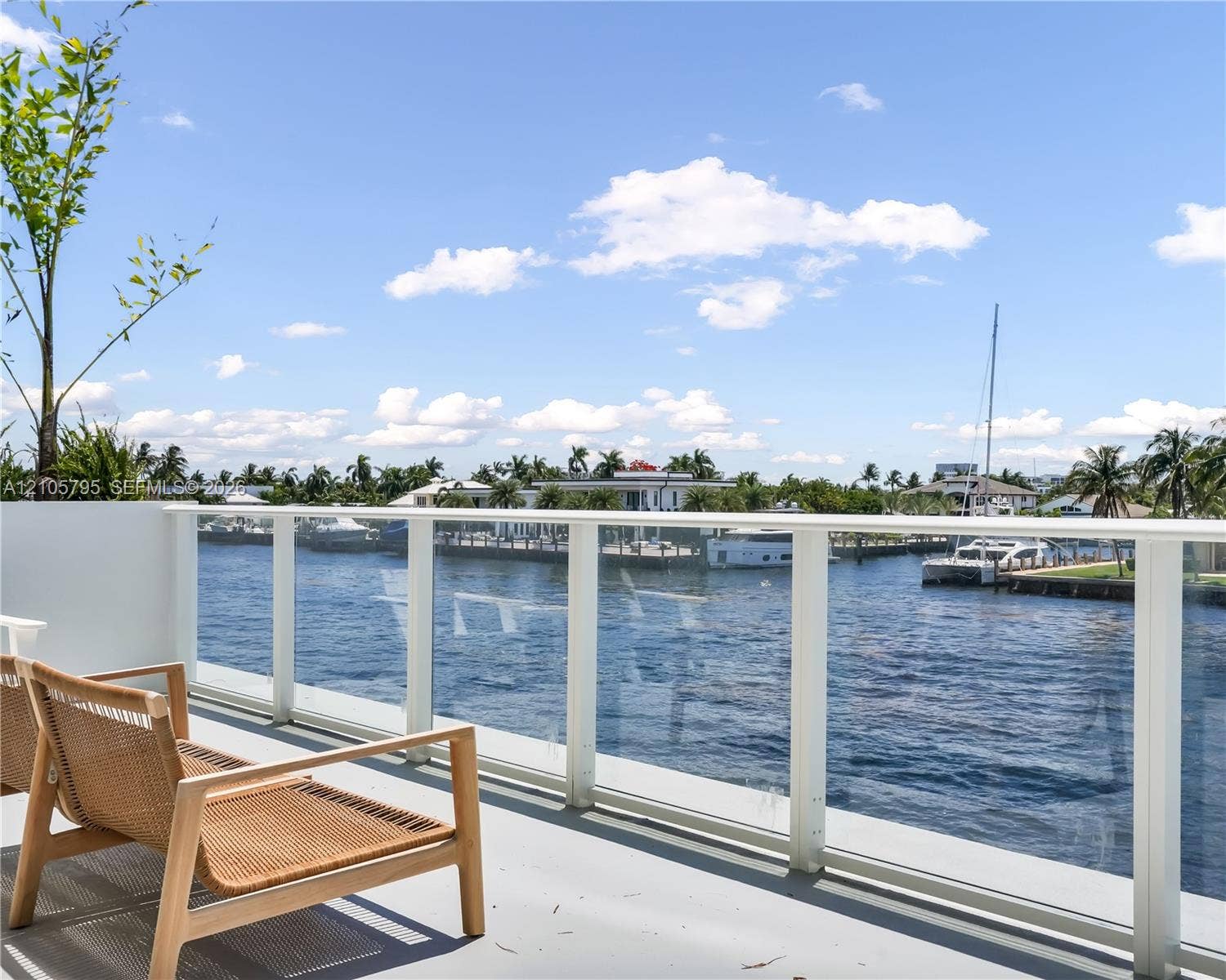 407 N Riverside Drive, #202, Pompano Beach, Pompano Beach, FL 33062 Elevated terrace featuring a water-facing glass panel railing and direct waterfront positioning