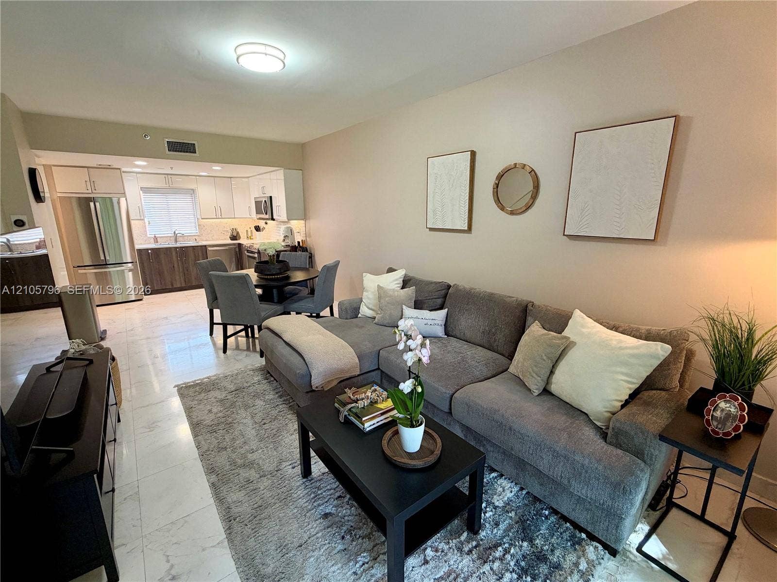 1611 SW 2nd Court, #A111, Miami, FL 33129 Open living /dining room with marble floors