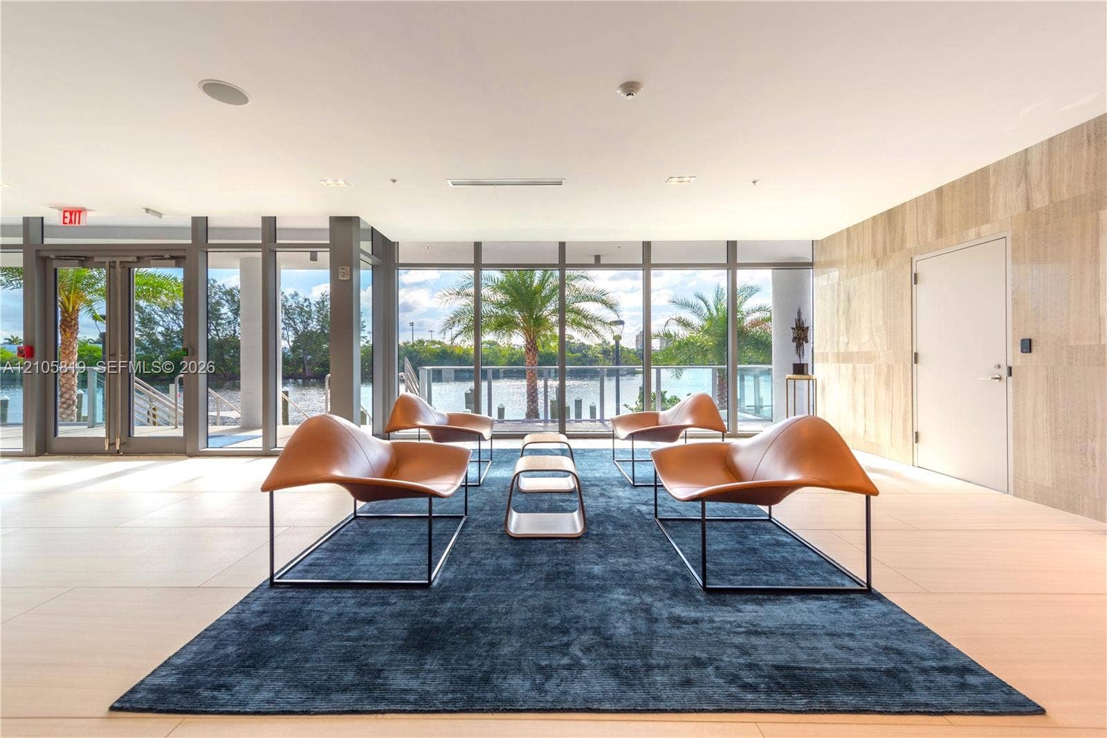 1180 N Federal Highway, #810, Fort Lauderdale, FL 33304 Waterfront Lobby. Floor-to-ceiling glass paneling, tile flooring, natural stone wall finish, and exterior water access