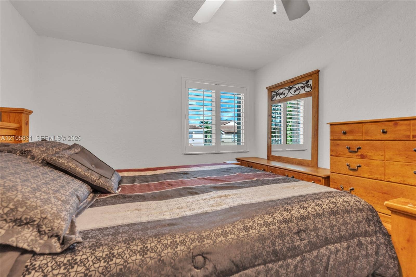 15612 SW 16th Court, Pembroke Pines, FL 33027 Room featuring white walls, a ceiling fan, and window plantation shutters