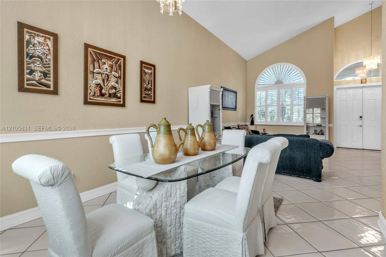 15612 SW 16th Court, Pembroke Pines, FL 33027 Vaulted ceilings, arched windows with plantation shutters, tile flooring, and chair rail molding