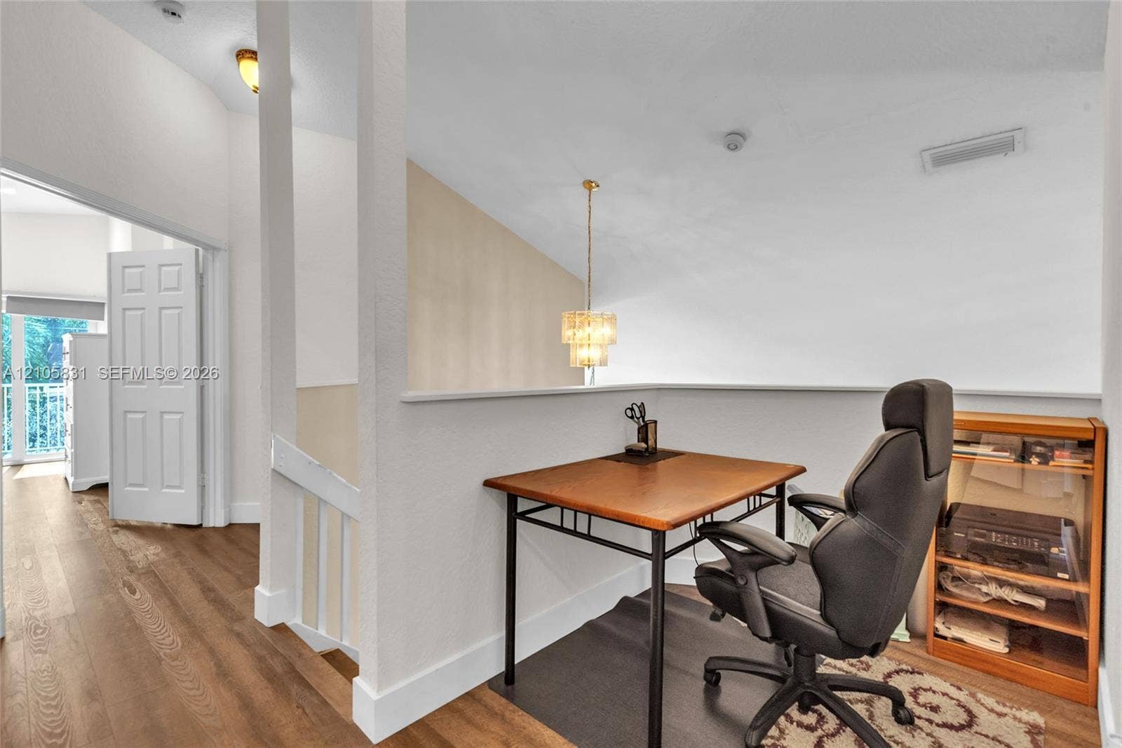 15612 SW 16th Court, Pembroke Pines, FL 33027 Vaulted ceilings, multi-level pendant lighting, wood-finish flooring, and white interior doors