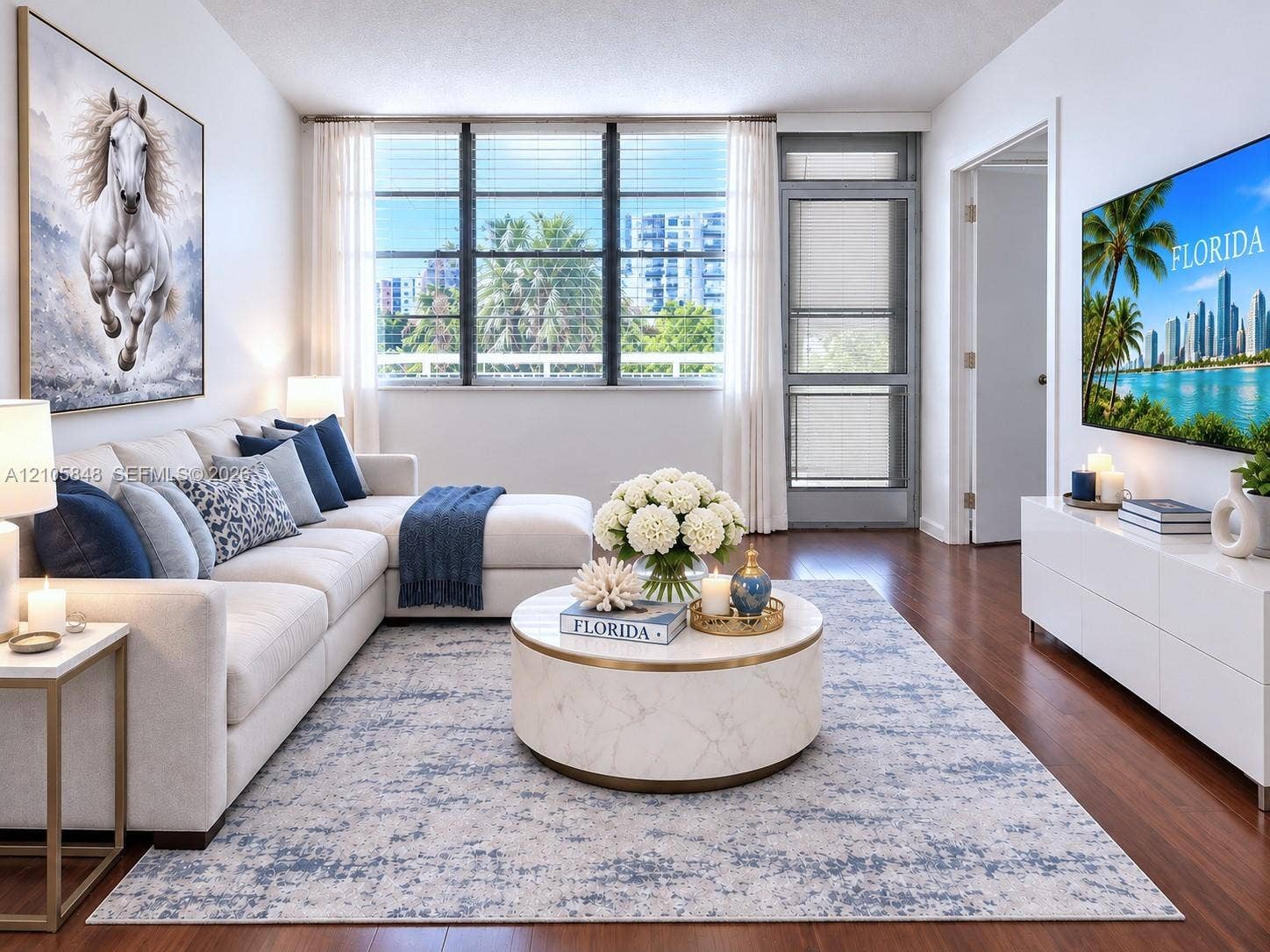 Living area featuring wood-finish flooring, large multi-pane windows, and a glass-paneled door