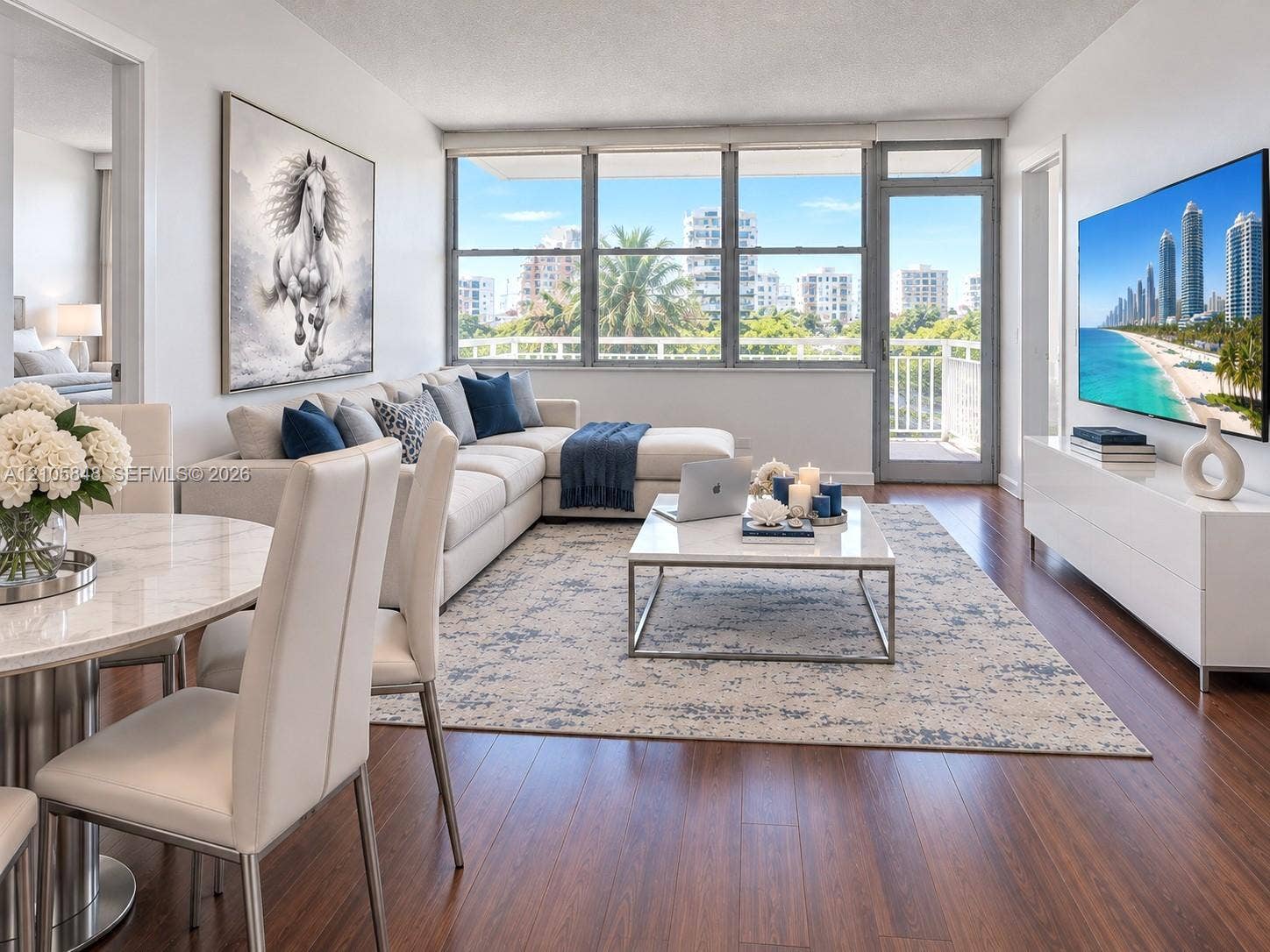 Living area featuring dark wood-finish flooring, floor-to-ceiling windows, and a glass-paneled door opening to a private balcony
