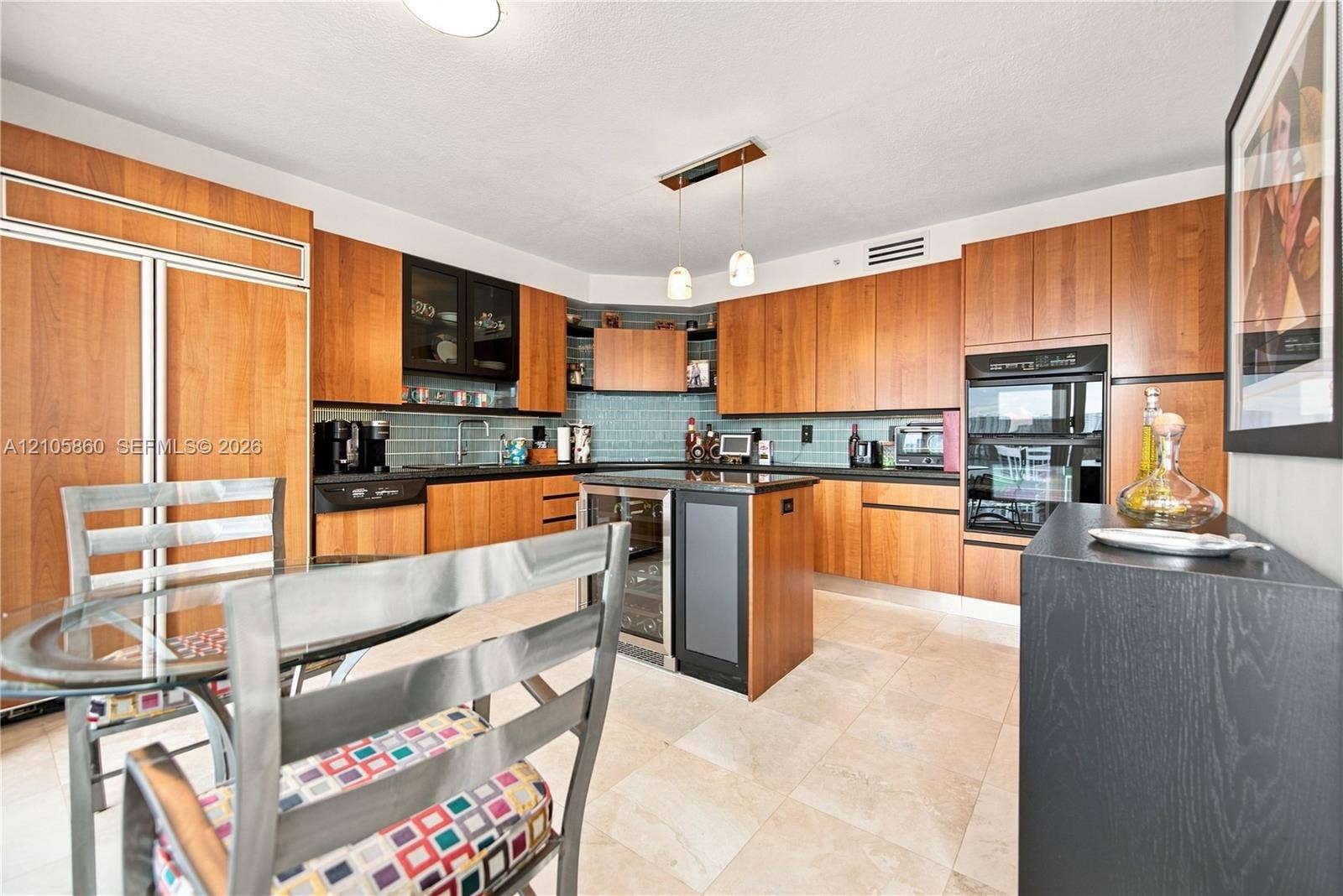 17555 Collins Avenue, #1903, Sunny Isles Beach, FL 33160 Kitchen featuring flat-panel wood cabinetry, stone countertops, tiled backsplash, center island with built-in wine refrigeration, and stainless steel wall-mounted oven