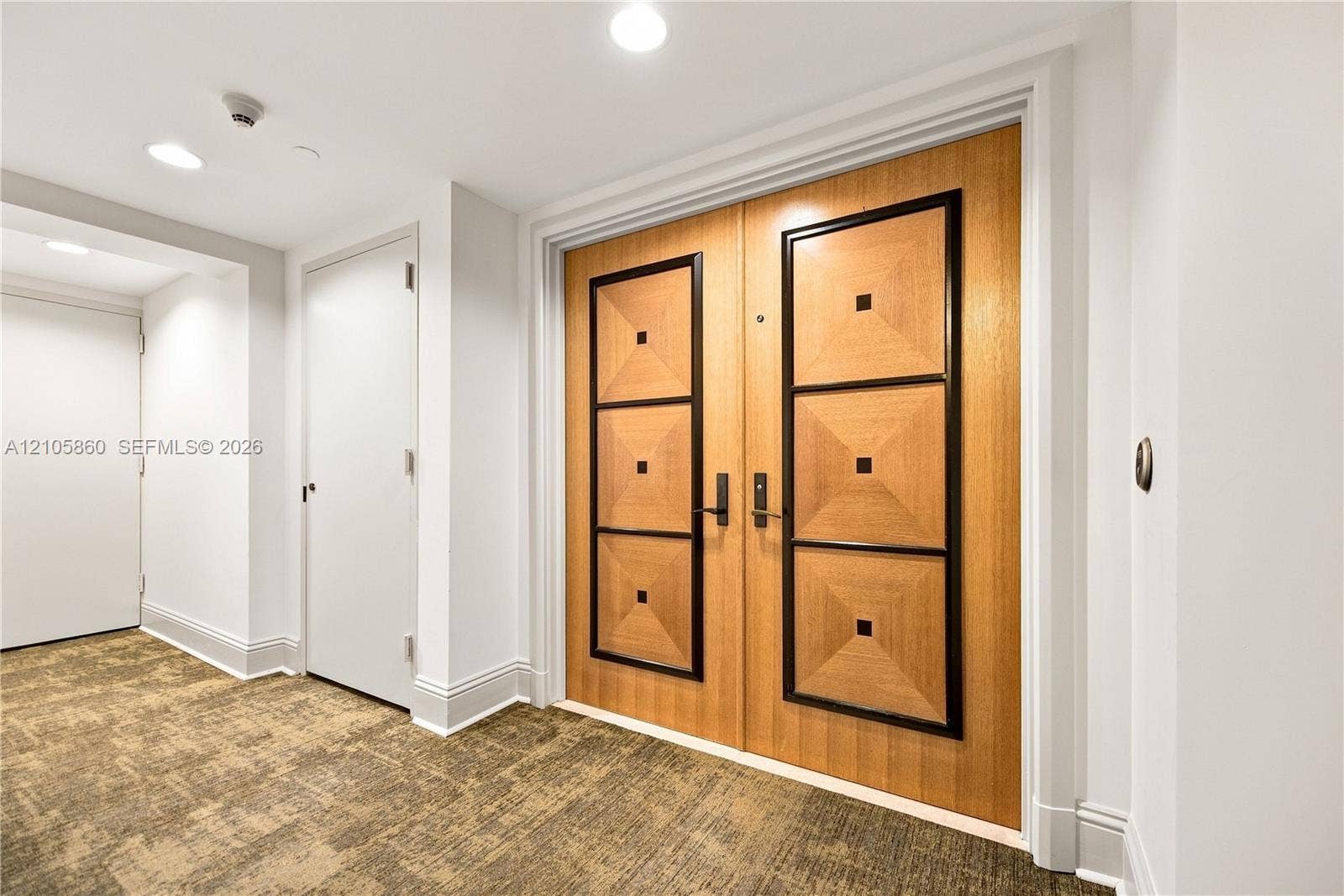 17555 Collins Avenue, #1903, Sunny Isles Beach, FL 33160 Double-door entry featuring a wood finish with geometric trim detailing and recessed lighting