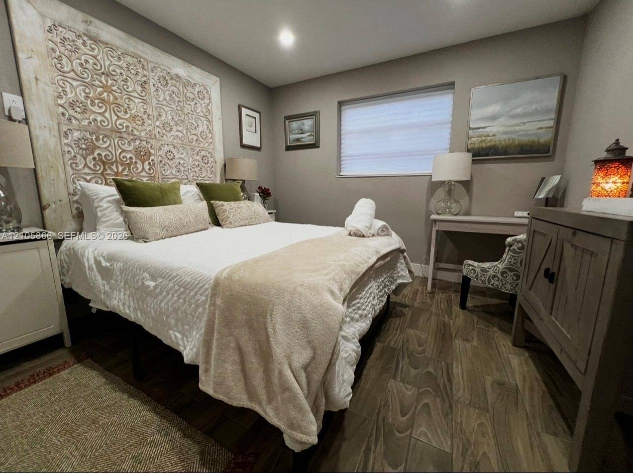 11241 SW 7th Terrace, Sweetwater, FL 33174 main house br 1 Wood-finish tile flooring, recessed lighting, and a large decorative wall-mounted architectural panel