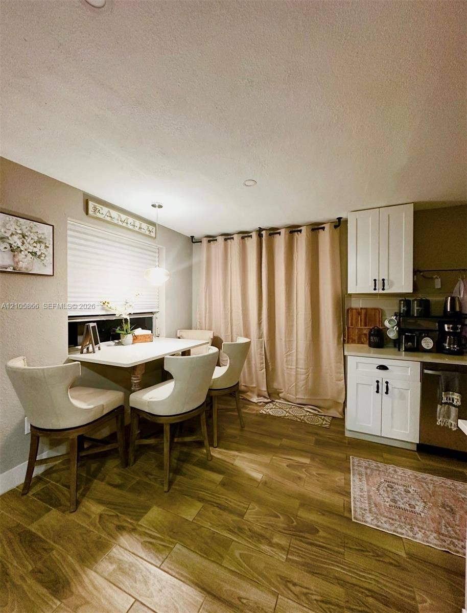 11241 SW 7th Terrace, Sweetwater, FL 33174 White cabinetry with matte black hardware,Main House wood-finish flooring, and recessed ceiling lighting
