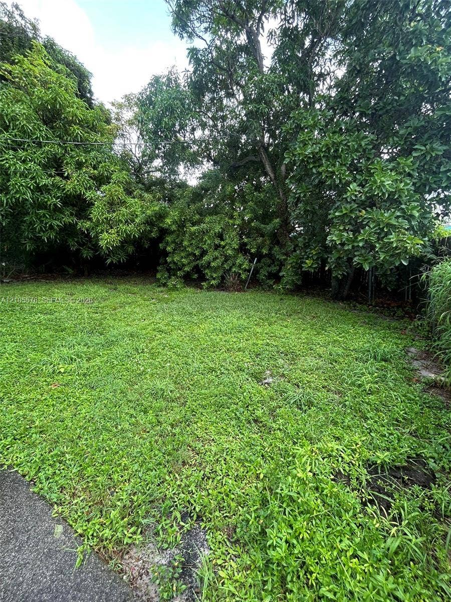 Riviera Beach, Riviera Beach, FL 33404 Outdoor space featuring mature trees and established greenery