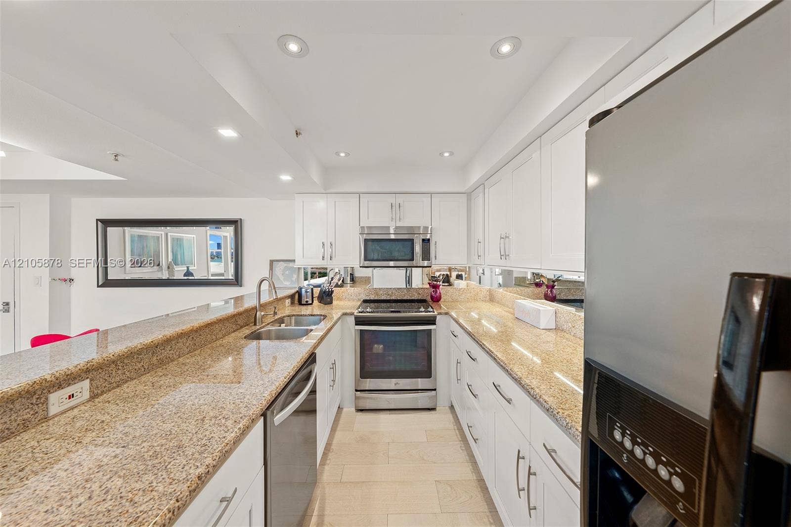 650 West Avenue, #1807, Miami Beach, FL 33139 Kitchen featuring white cabinetry, stone countertops, stainless steel appliances, a double-basin sink, and tile flooring