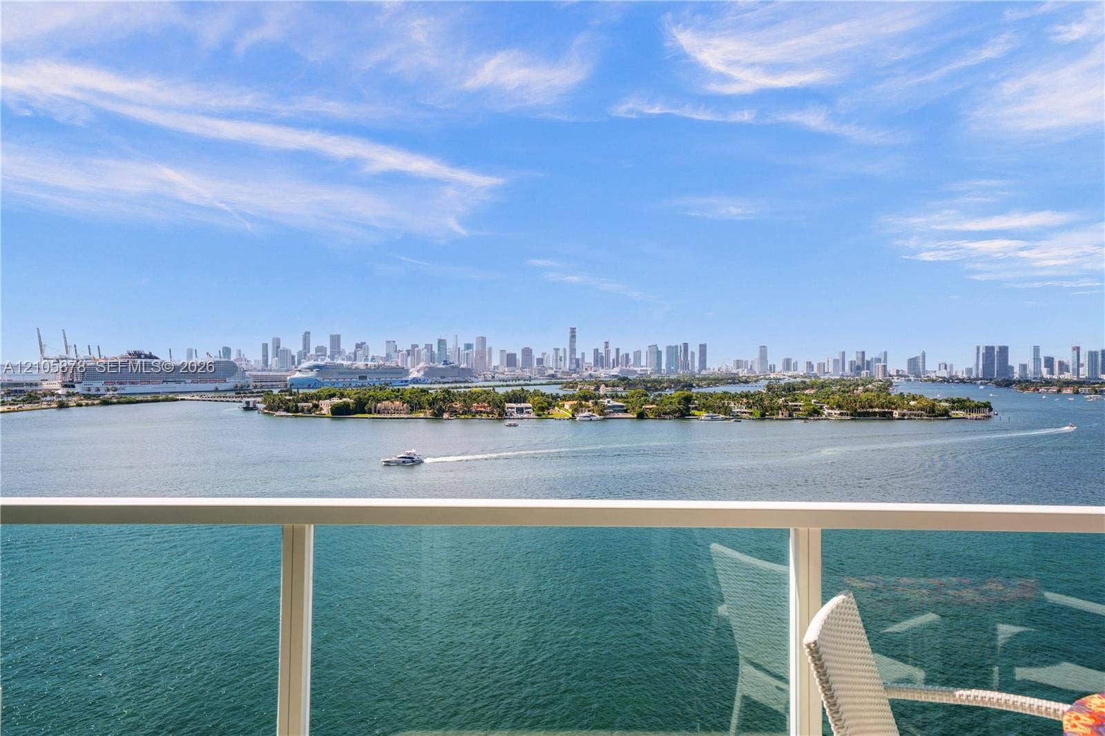 650 West Avenue, #1807, Miami Beach, FL 33139 Balcony featuring a glass panel railing and panoramic waterfront and city skyline scenery