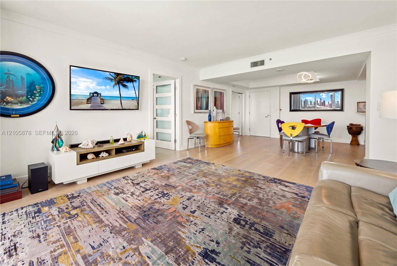 650 West Avenue, #1807, Miami Beach, FL 33139 Open-concept interior featuring light wood-finish flooring, recessed lighting, and a multi-panel door with frosted glass inserts