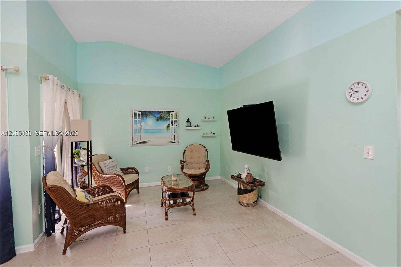527 SE 21st Drive, Homestead, FL 33033 Vaulted ceilings, neutral tile flooring, and integrated wall-mounted shelving