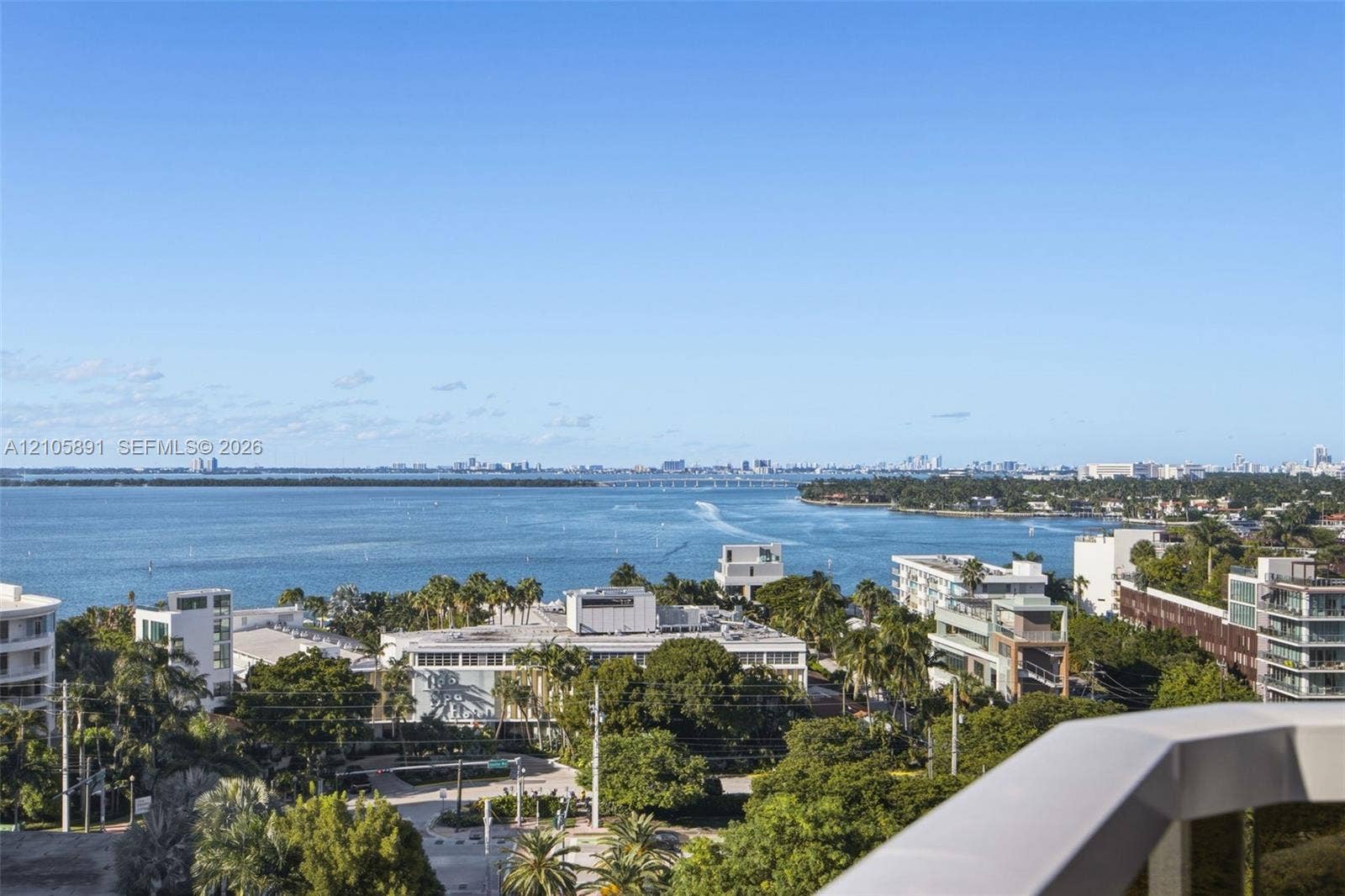 9 Island Avenue, #1215, Miami Beach, FL 33139 Elevated balcony with a solid white railing, offering expansive bay and coastal water horizon scenes