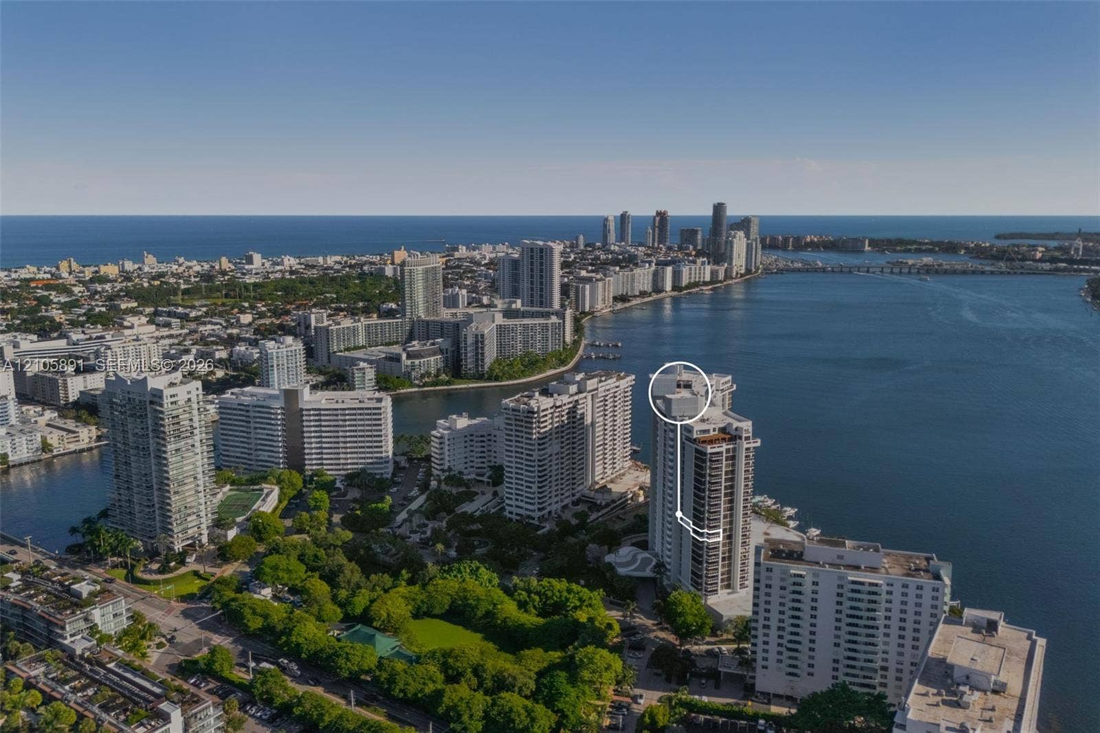 9 Island Avenue, #1215, Miami Beach, FL 33139 Aerial perspective of coastal high-rise residence featuring direct water frontage, proximity to the coastline, and a prominent position within a dense urban landscape