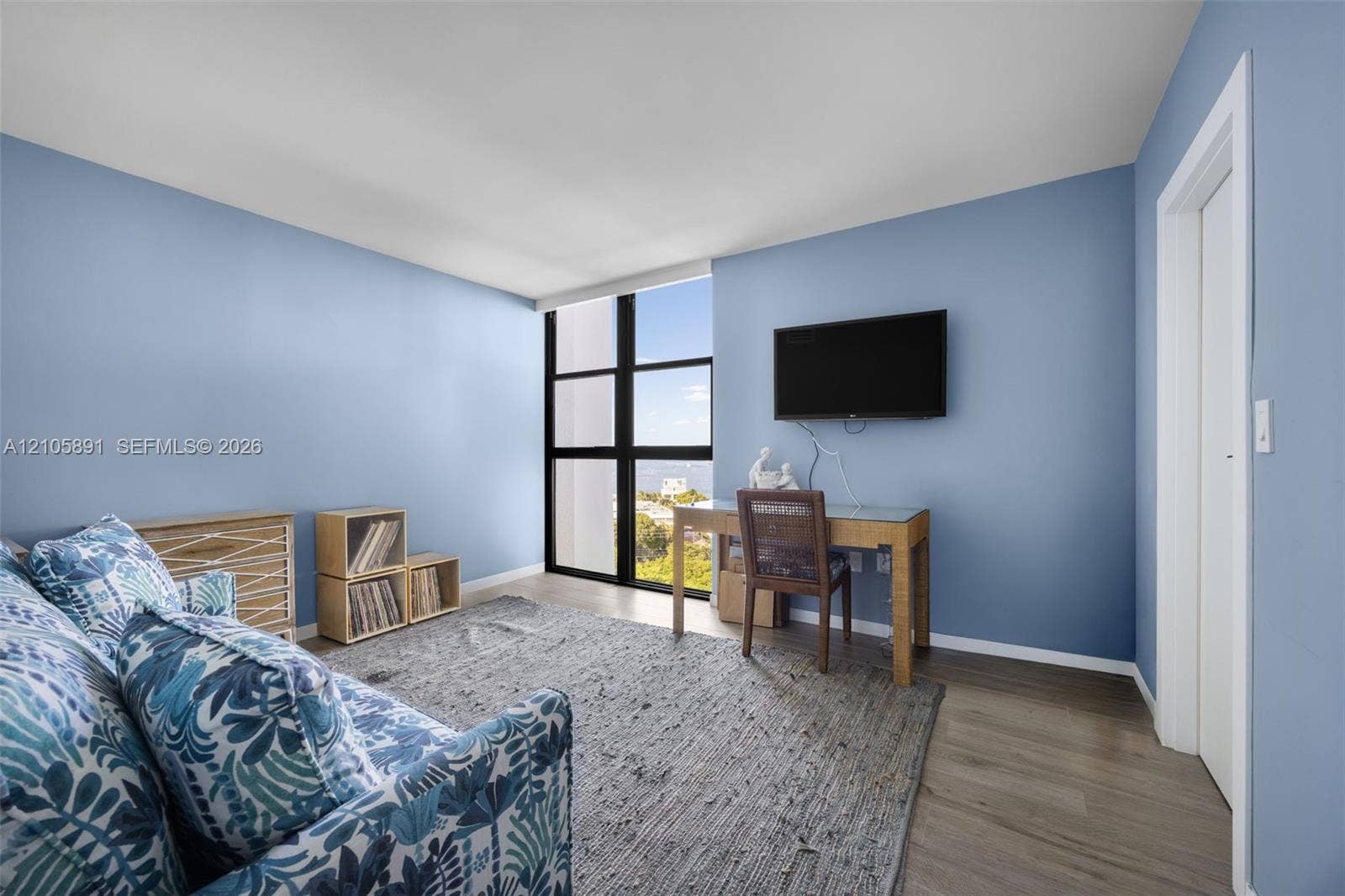 9 Island Avenue, #1215, Miami Beach, FL 33139 Floor-to-ceiling windows with black framing and wood-finish flooring