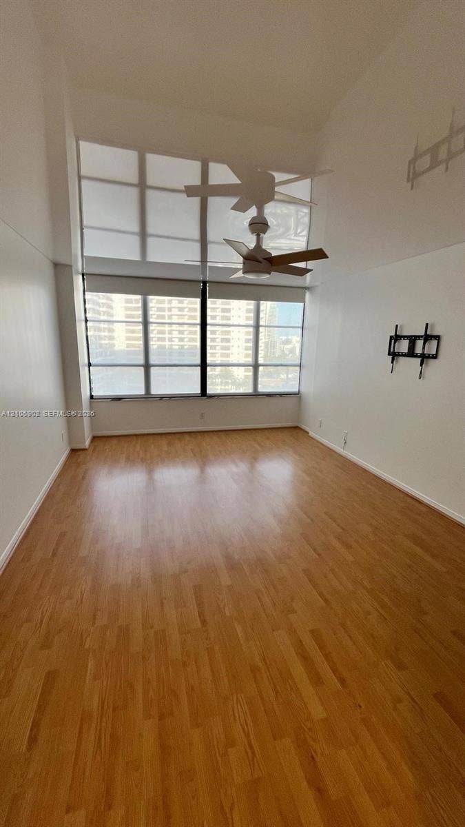 600 Three Islands Boulevard, #913, Hallandale Beach, Hallandale Beach, FL 33009 High ceilings, wood-finish flooring, floor-to-ceiling windows, and ceiling fan fixture