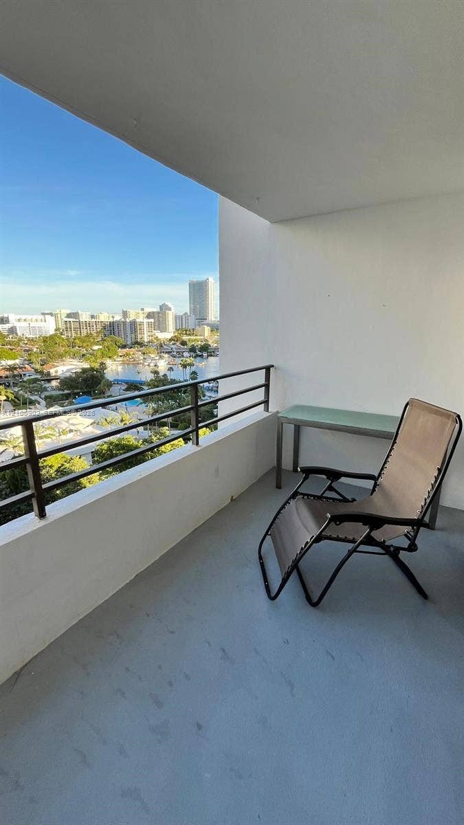600 Three Islands Boulevard, #913, Hallandale Beach, Hallandale Beach, FL 33009 Covered balcony featuring a horizontal-rail metal railing and solid concrete flooring
