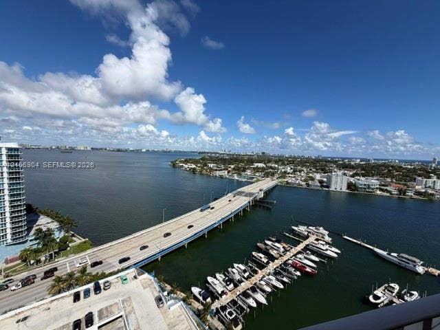 7601 E Treasure Drive, #2417, North Bay Village, North Bay Village, FL 33141 Elevated water scenery featuring a marina with docking slips, an expansive waterway, and bridge infrastructure