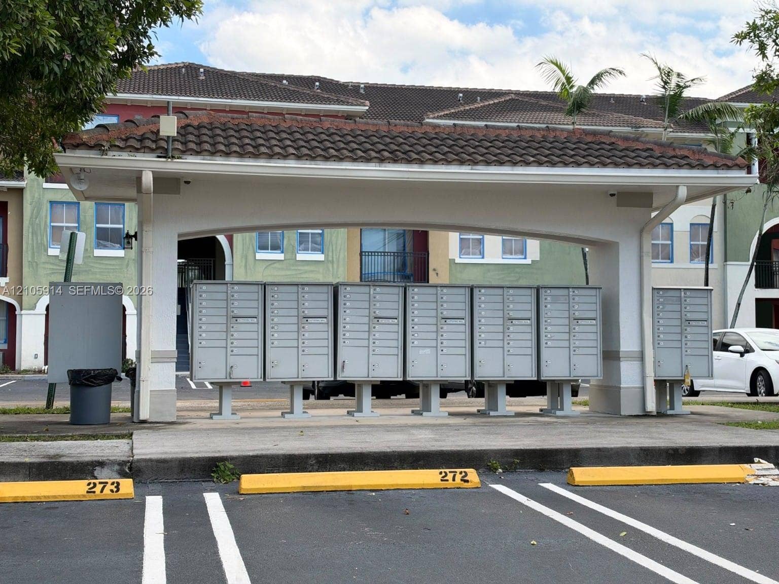 11102 NW 83rd Street, #216, Doral, FL 33178 Covered mailbox kiosk featuring a tiled roof structure and integrated metal parcel boxes
