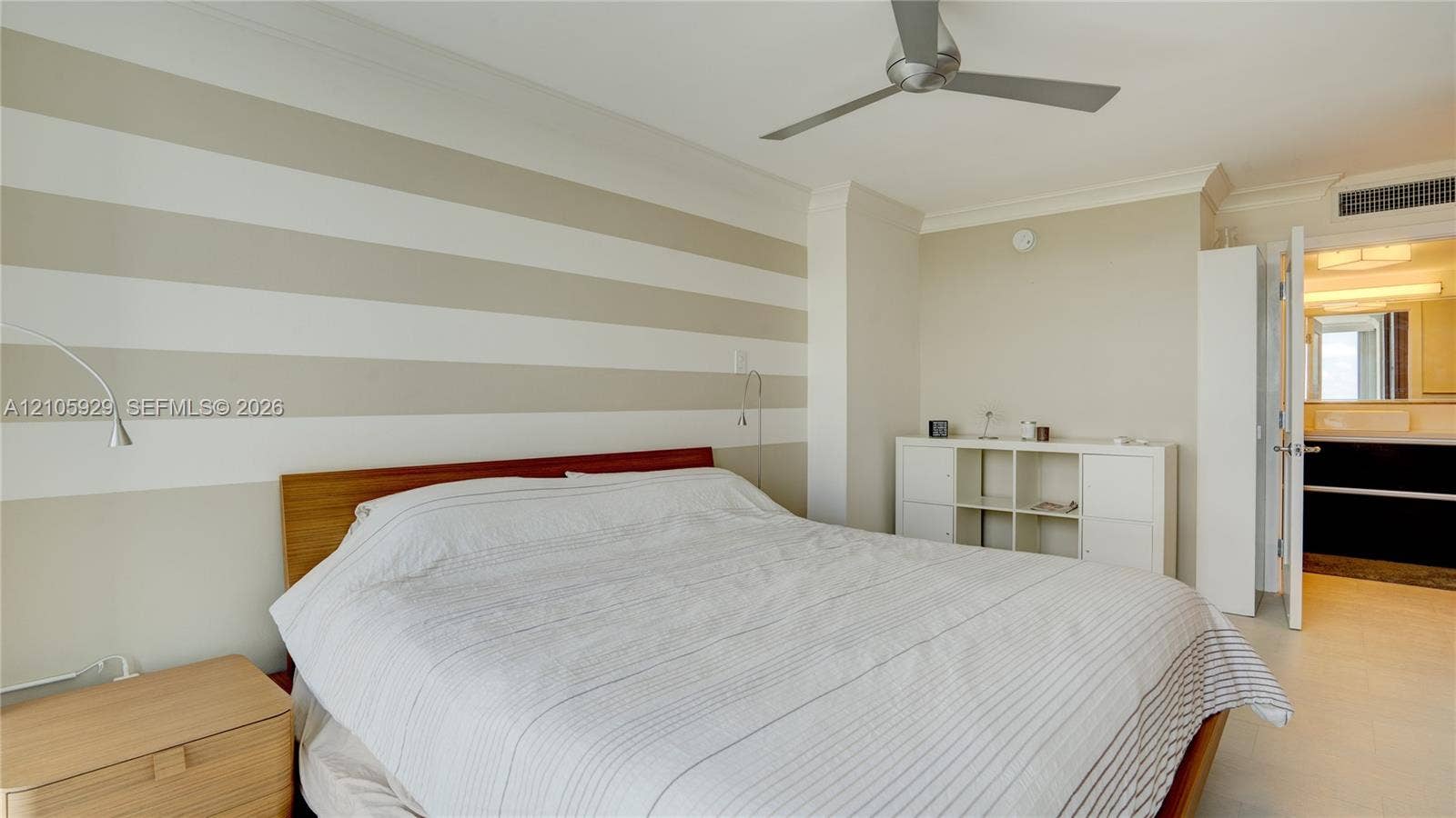 2655 Collins Avenue, #2301, Miami Beach, FL 33140 Interior room featuring crown molding, a multi-blade ceiling fan, and large-format tile flooring