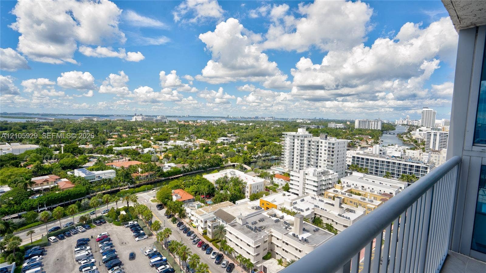 2655 Collins Avenue, #2301, Miami Beach, FL 33140 Elevated balcony with a metal railing offering expansive horizon and urban scenery