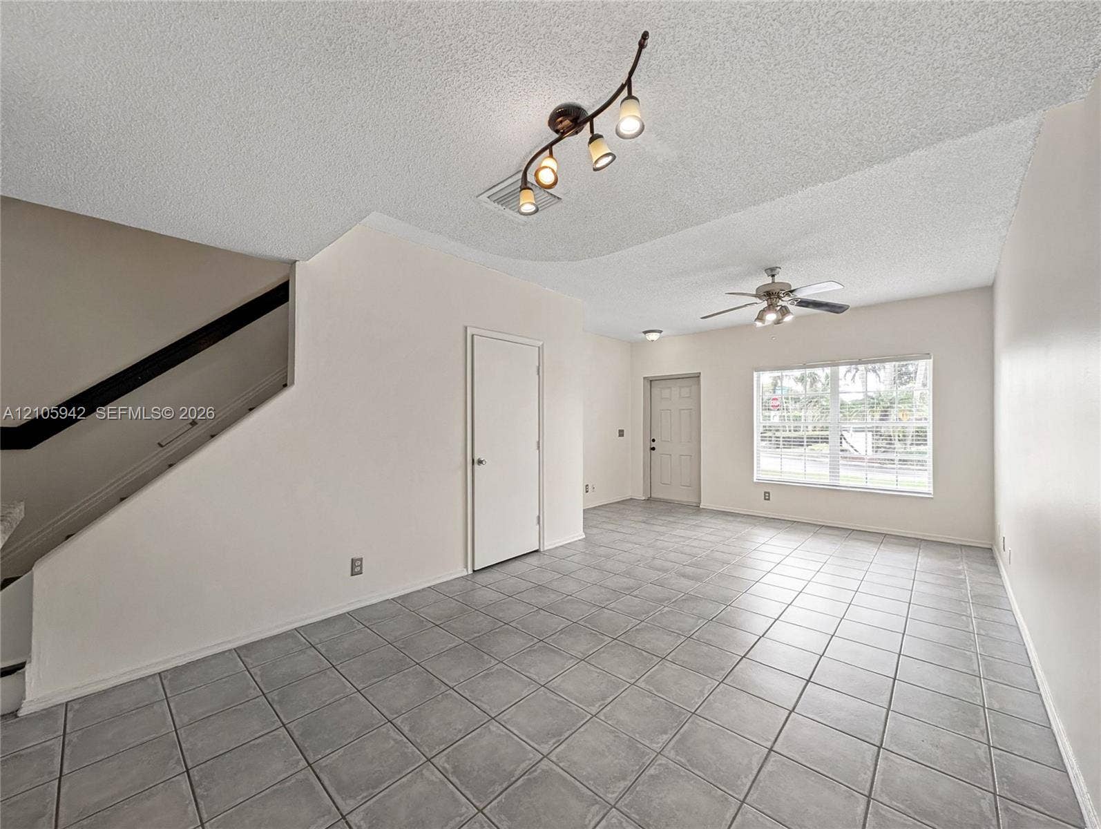 271 Duval Court, Weston, Weston, FL 33326 living ceramic floor tile, vaulted ceilings, a ceiling fan with integrated lighting