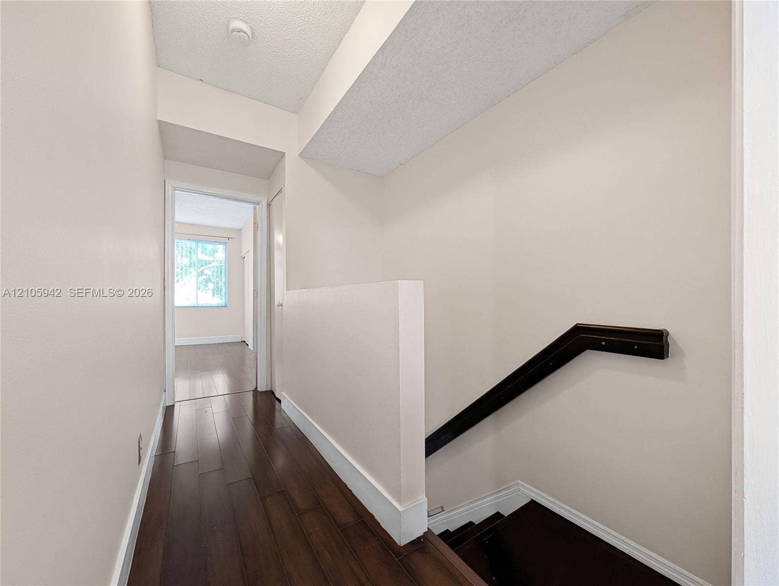 271 Duval Court, Weston, Weston, FL 33326 Wood-finish flooring, half-wall staircase enclosure, and dark wood handrail