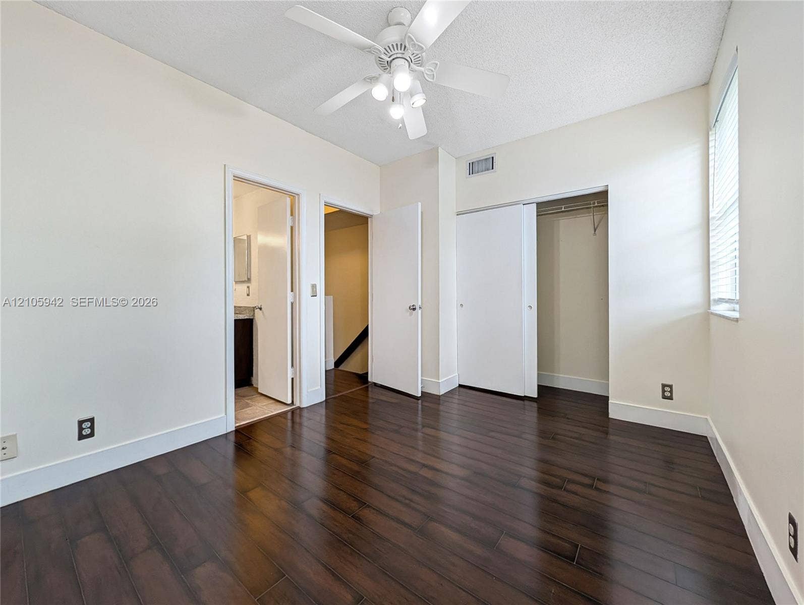 271 Duval Court, Weston, Weston, FL 33326 Wood-finish flooring, ceiling fan with integrated lighting, window with horizontal blinds, and sliding closet doors