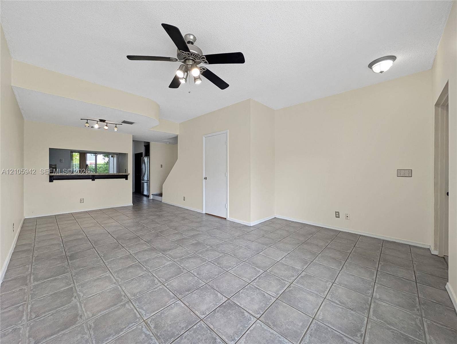 271 Duval Court, Weston, Weston, FL 33326 living ceramic floor tile, vaulted ceilings, a ceiling fan with integrated lighting