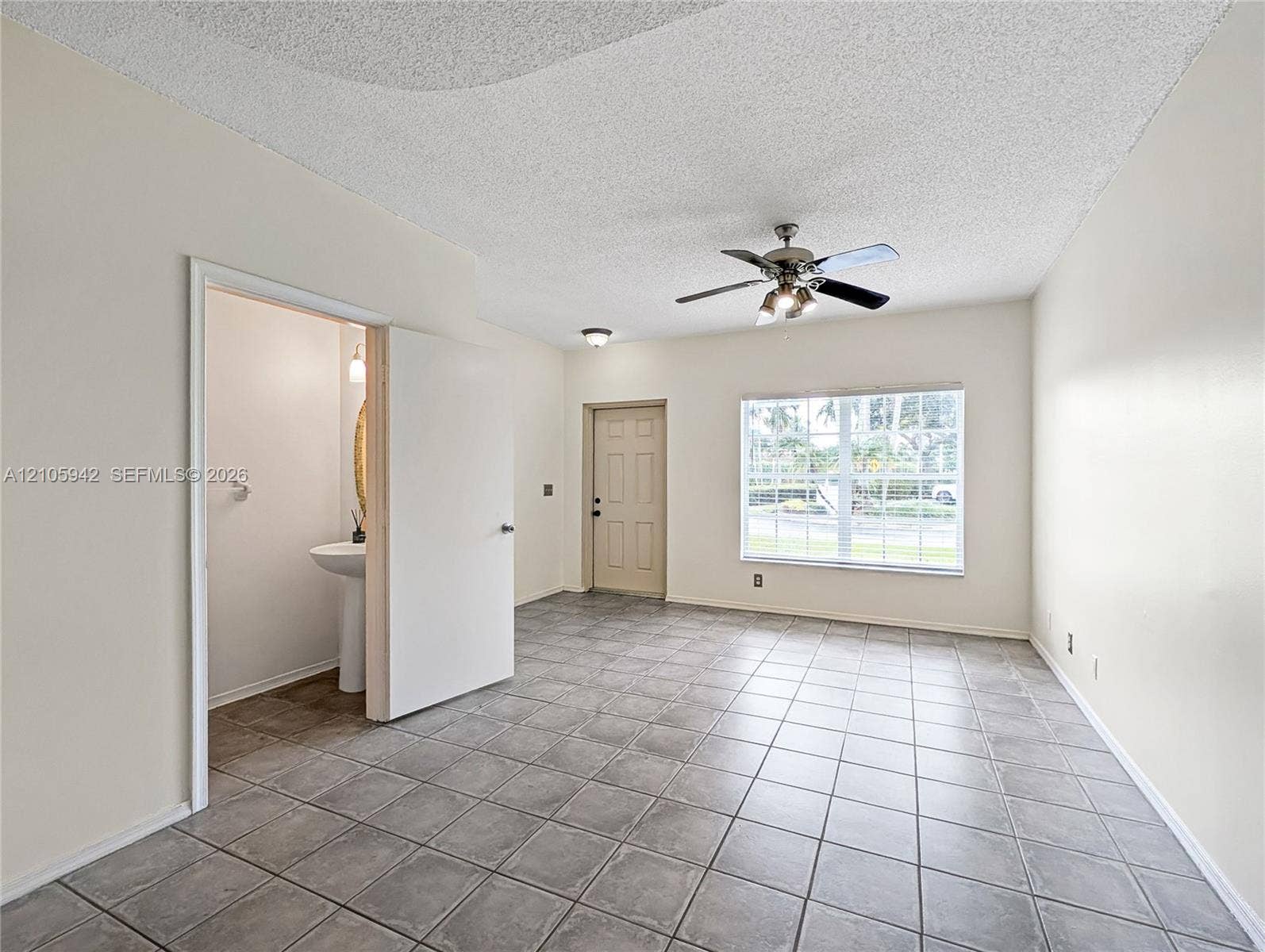 271 Duval Court, Weston, Weston, FL 33326 living ceramic floor tile, vaulted ceilings, a ceiling fan with integrated lighting