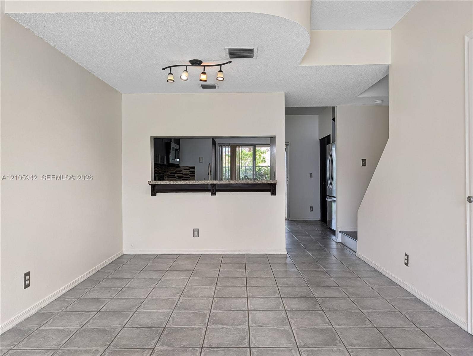 271 Duval Court, Weston, Weston, FL 33326 living ceramic floor tile, vaulted ceilings, a ceiling fan with integrated lighting