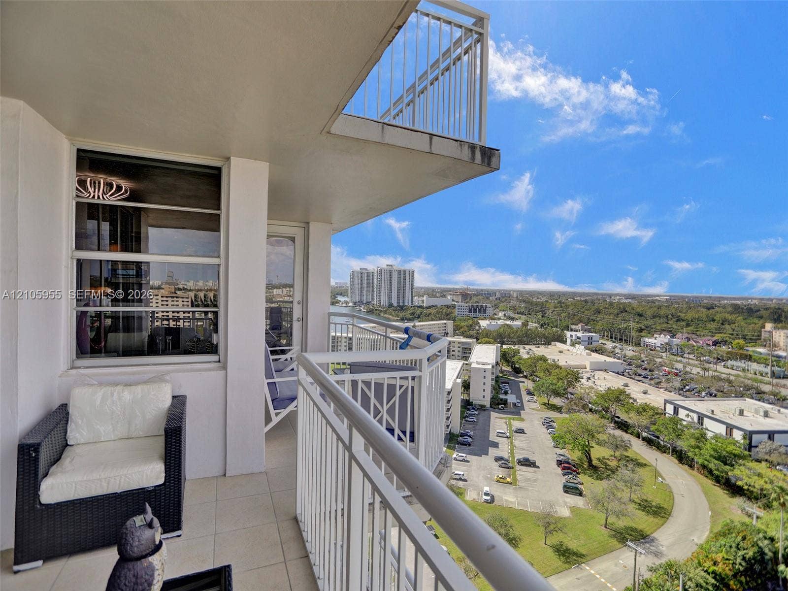 18011 Biscayne Boulevard, #1904, Aventura, FL 33160 Covered balcony with white metal railings and tile flooring