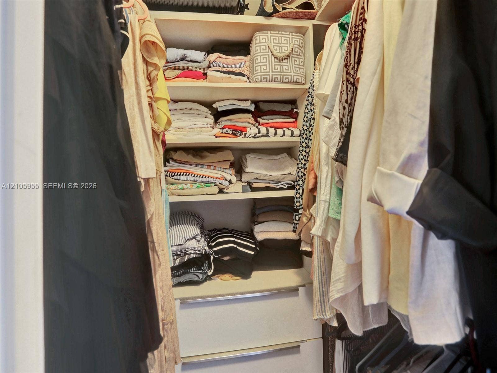 18011 Biscayne Boulevard, #1904, Aventura, FL 33160 Closet featuring built-in shelving and two pull-out drawers with integrated hardware