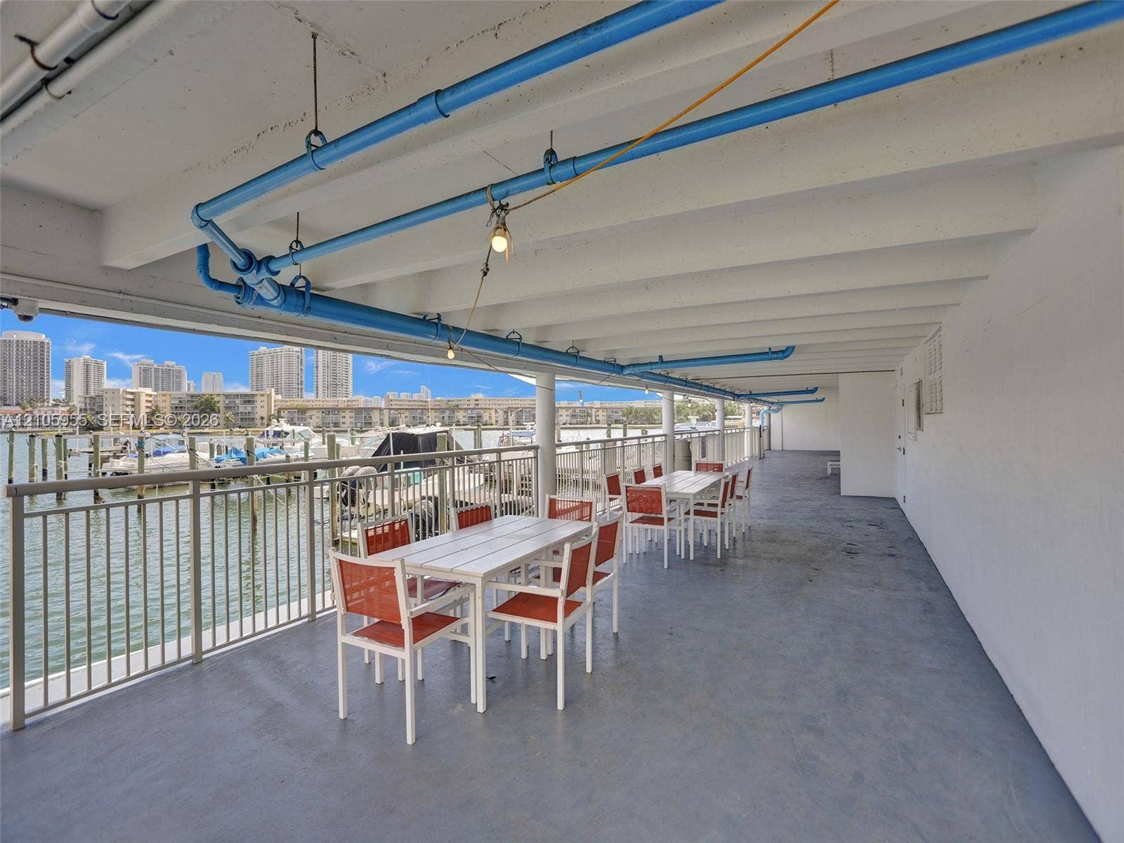 18011 Biscayne Boulevard, #1904, Aventura, FL 33160 Covered outdoor terrace featuring a concrete floor, metal railings, and direct water access