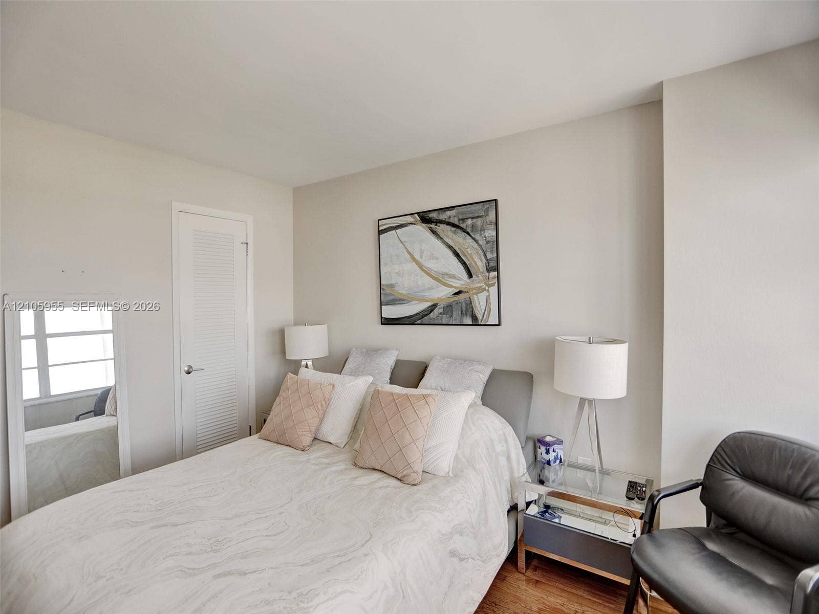 18011 Biscayne Boulevard, #1904, Aventura, FL 33160 Neutral wall color, wood-finish flooring, and single-panel door with louvred upper detail