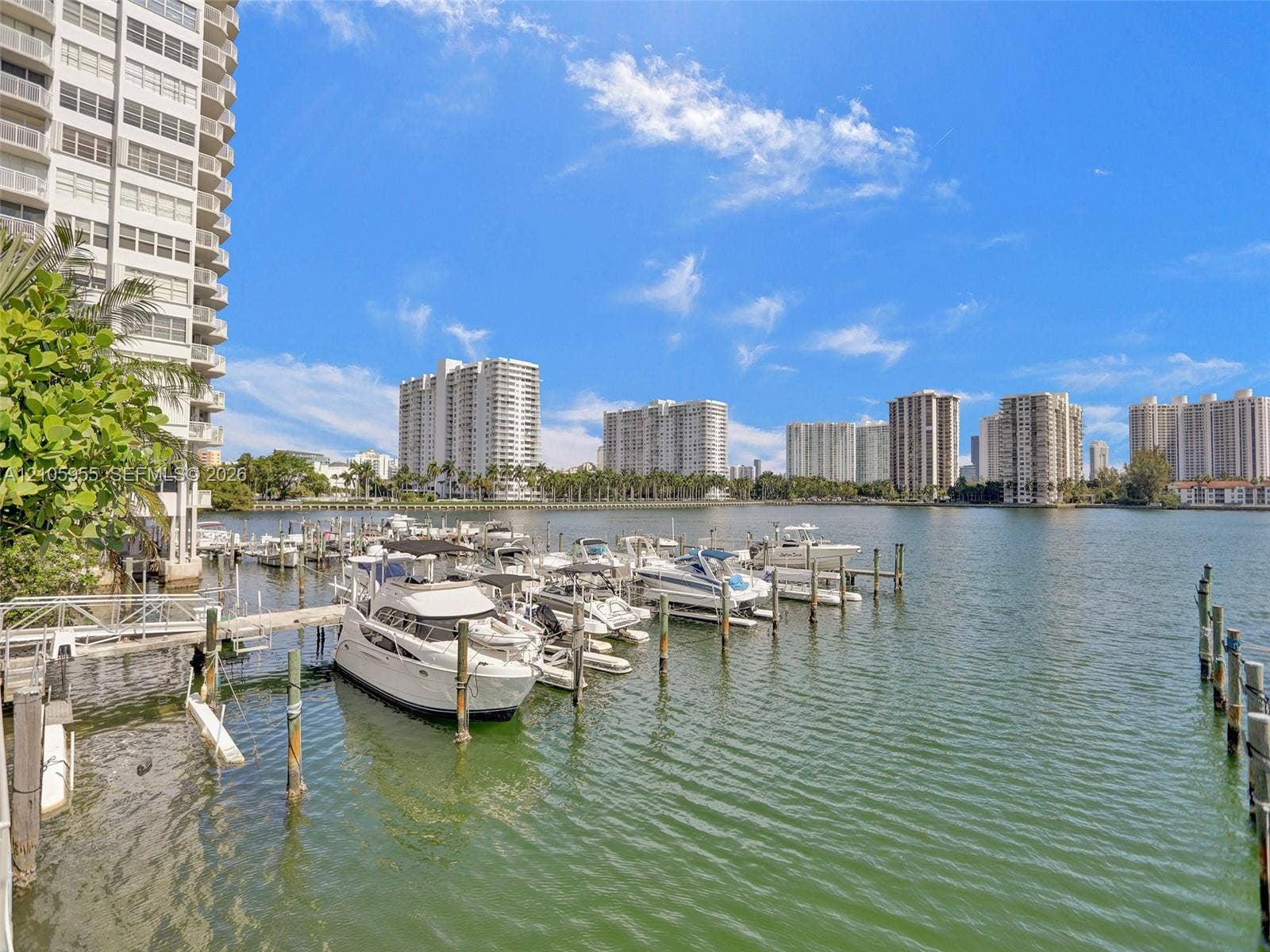 18011 Biscayne Boulevard, #1904, Aventura, FL 33160 Waterfront bulkhead featuring a private boat slip, wooden pilings, and direct deep-water access
