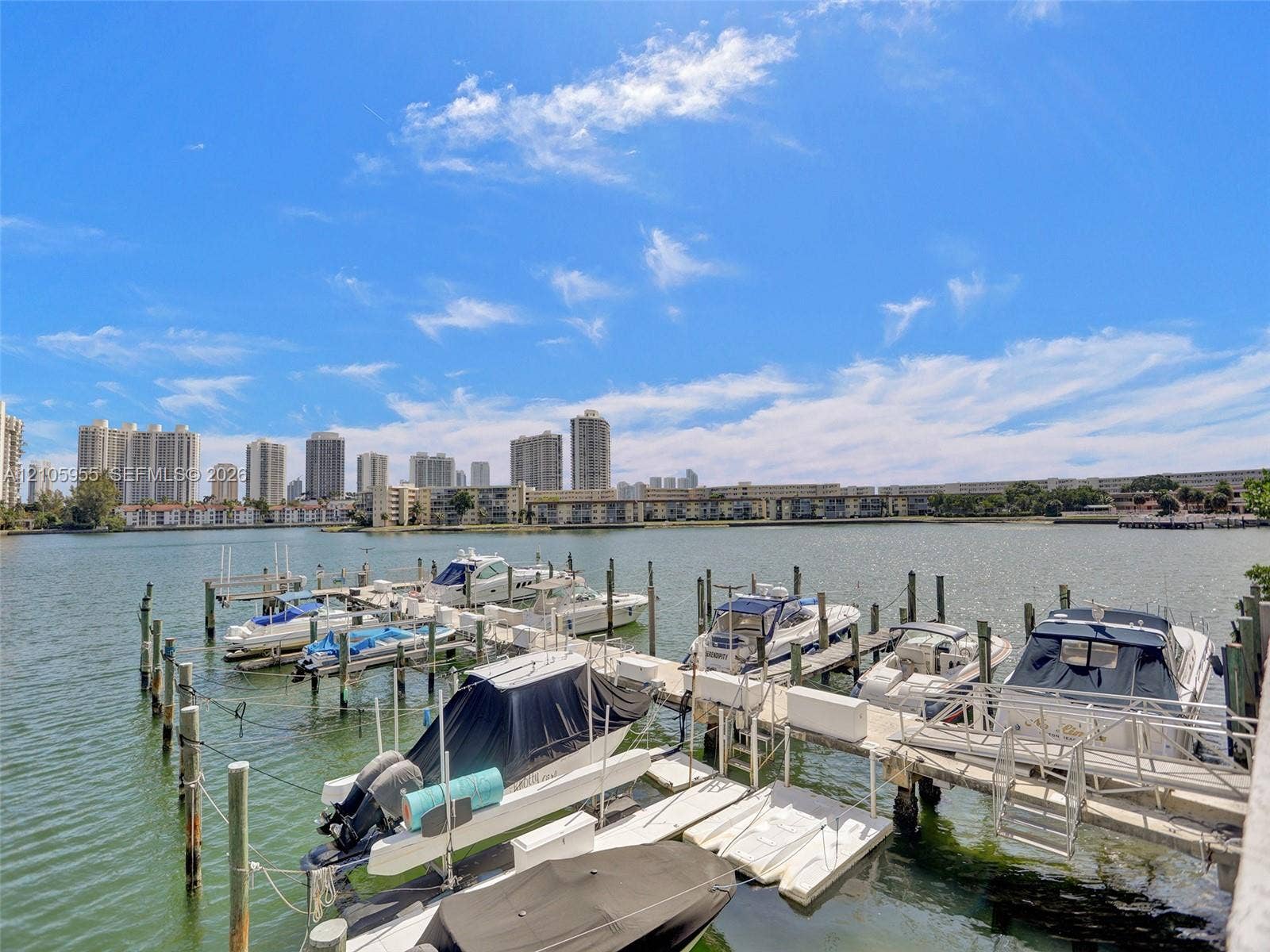 18011 Biscayne Boulevard, #1904, Aventura, FL 33160 Waterfront dock featuring multiple boat slips and pilings