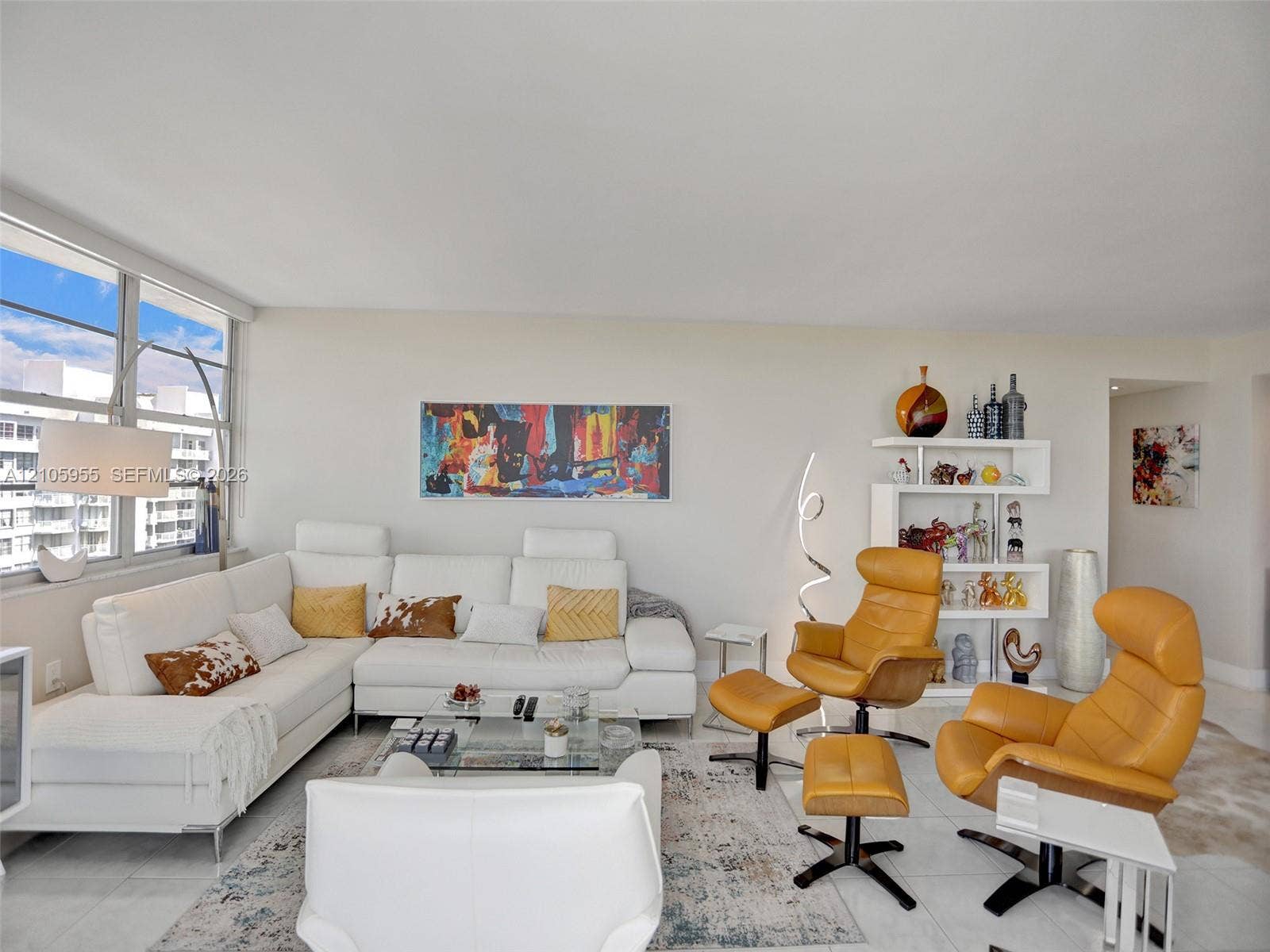 18011 Biscayne Boulevard, #1904, Aventura, FL 33160 Living area featuring expansive floor-to-ceiling windows and large-format tile flooring