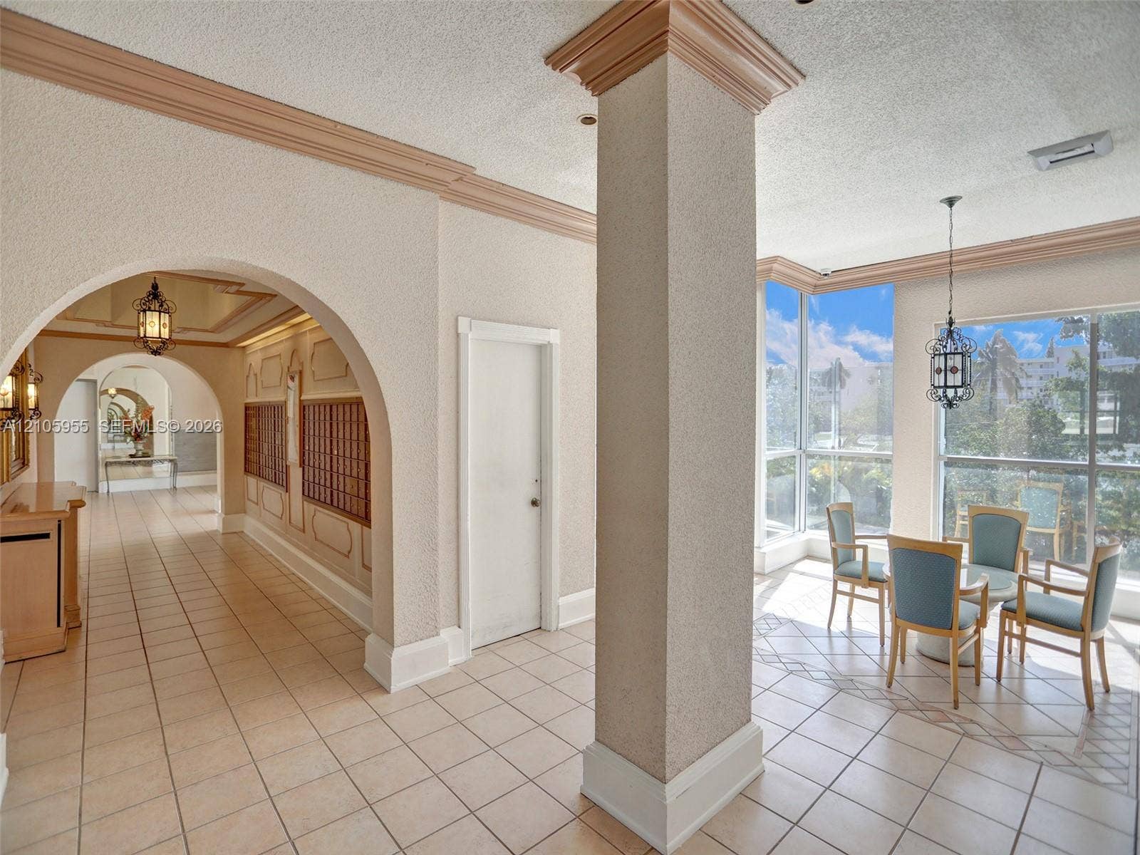 18011 Biscayne Boulevard, #1904, Aventura, FL 33160 Common area featuring arched architectural detailing, ceramic tile flooring, floor-to-ceiling windows, and recessed lighting