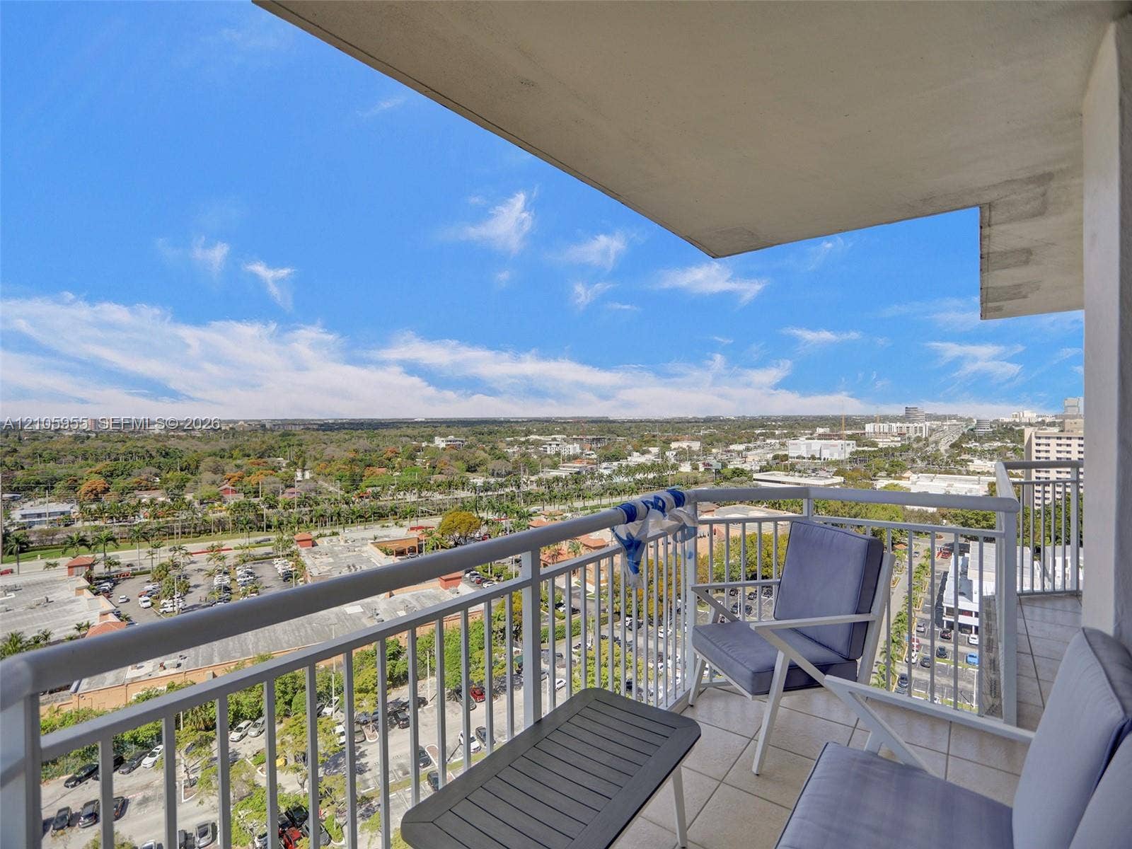 18011 Biscayne Boulevard, #1904, Aventura, FL 33160 Covered balcony featuring tile flooring and a white metal safety railing with extensive panoramic exterior surroundings