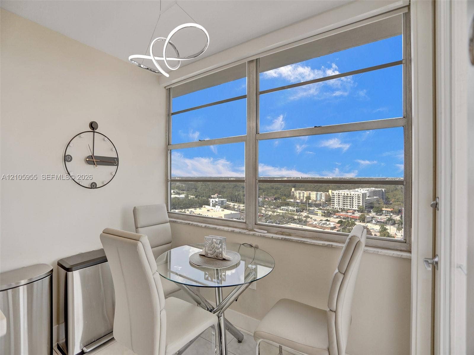 18011 Biscayne Boulevard, #1904, Aventura, FL 33160 Large windows featuring expansive exterior scenery, contemporary circular LED light fixture, and stone window sill