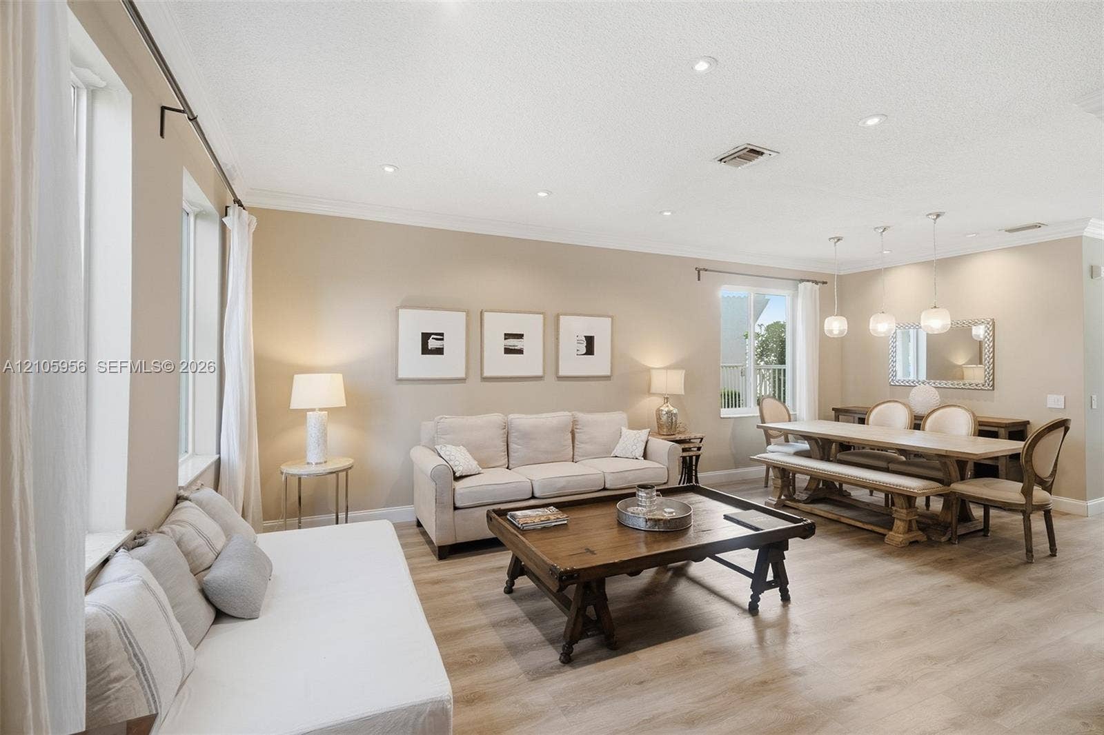 1154 Croton Court, Weston, Weston, FL 33327 Open-concept interior featuring wood-finish flooring, recessed lighting, crown molding, and pendant lighting over the dining area