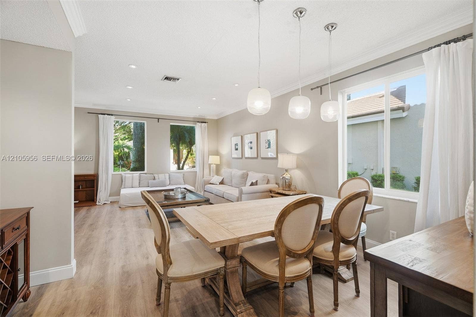 1154 Croton Court, Weston, Weston, FL 33327 Neutral interior space featuring wood-finish flooring, recessed lighting, crown molding, and glass globe pendant lighting
