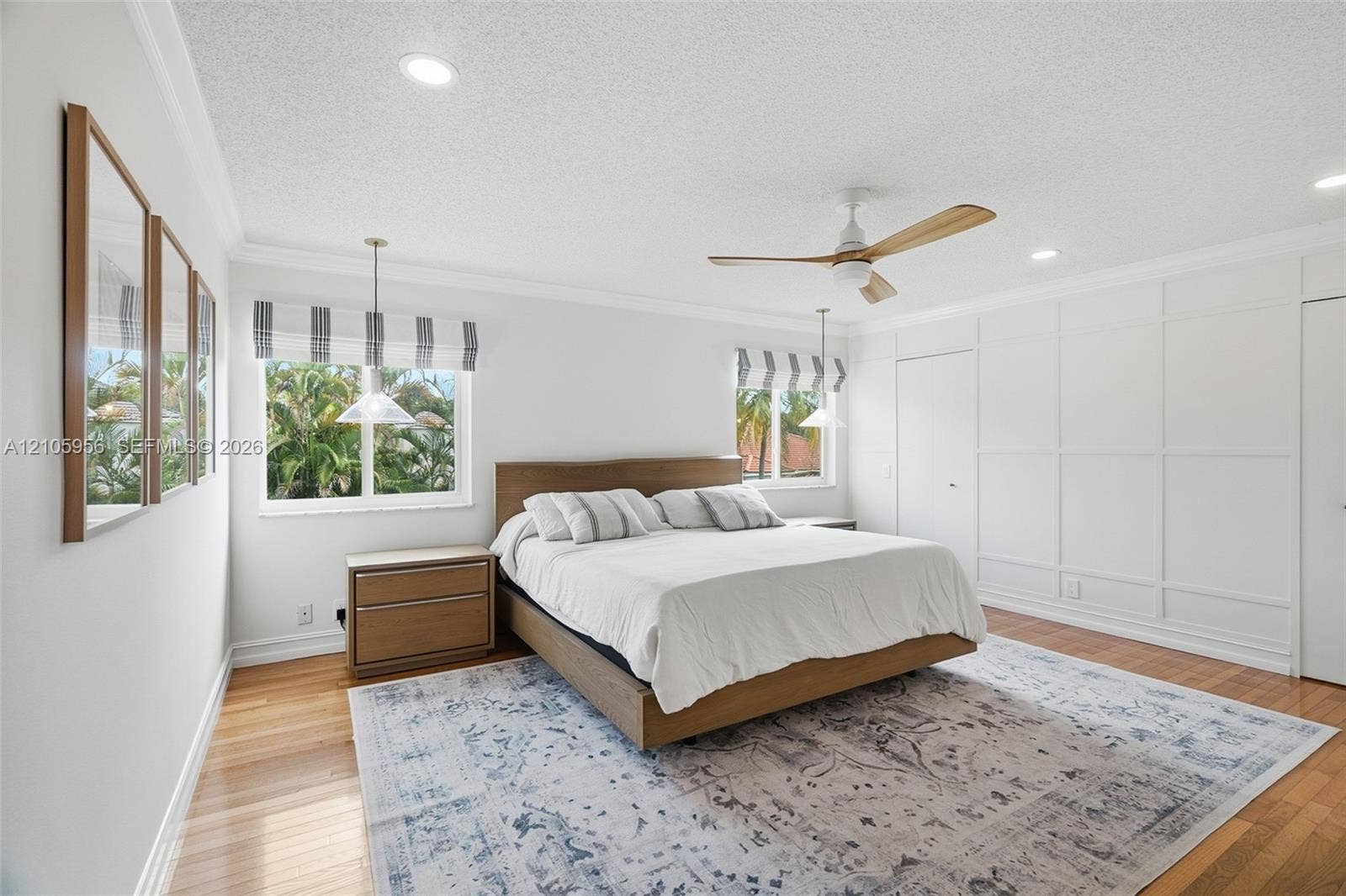 1154 Croton Court, Weston, Weston, FL 33327 Interior space featuring wood-finish flooring, decorative wall paneling, crown molding, a central ceiling fan with wood-finish blades, and recessed lighting