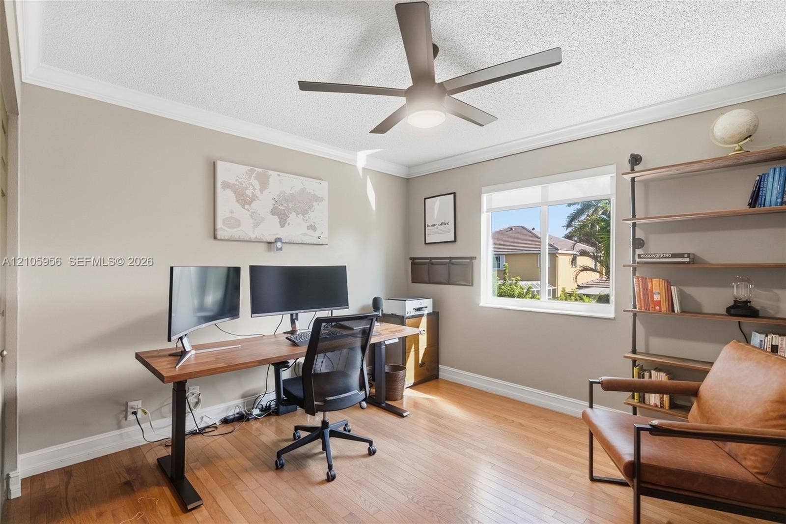 1154 Croton Court, Weston, Weston, FL 33327 Room featuring wood-finish flooring, a matte finish ceiling fan with integrated lighting, and a single-pane window