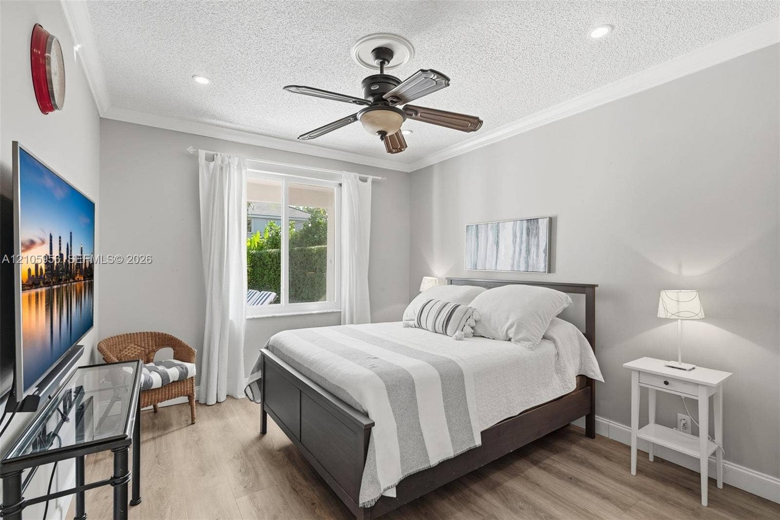 1154 Croton Court, Weston, Weston, FL 33327 Room on 1st Floor featuring wood-finish flooring, a ceiling fan with integrated lighting, recessed lighting, crown molding, and a sliding window