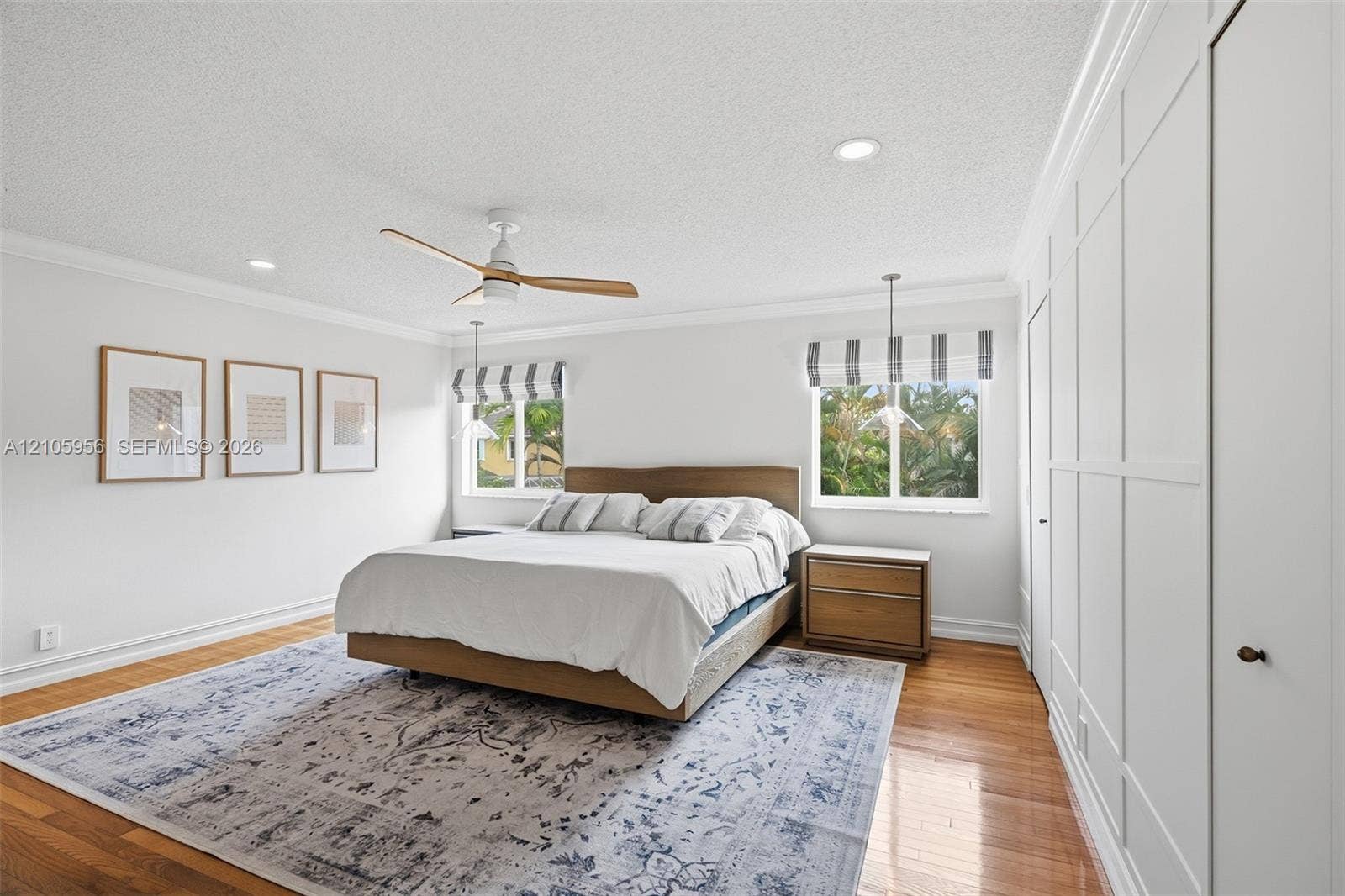 1154 Croton Court, Weston, Weston, FL 33327 Wood-finish flooring, ceiling fan with natural-tone blades, white board-and-batten wall paneling, and recessed lighting