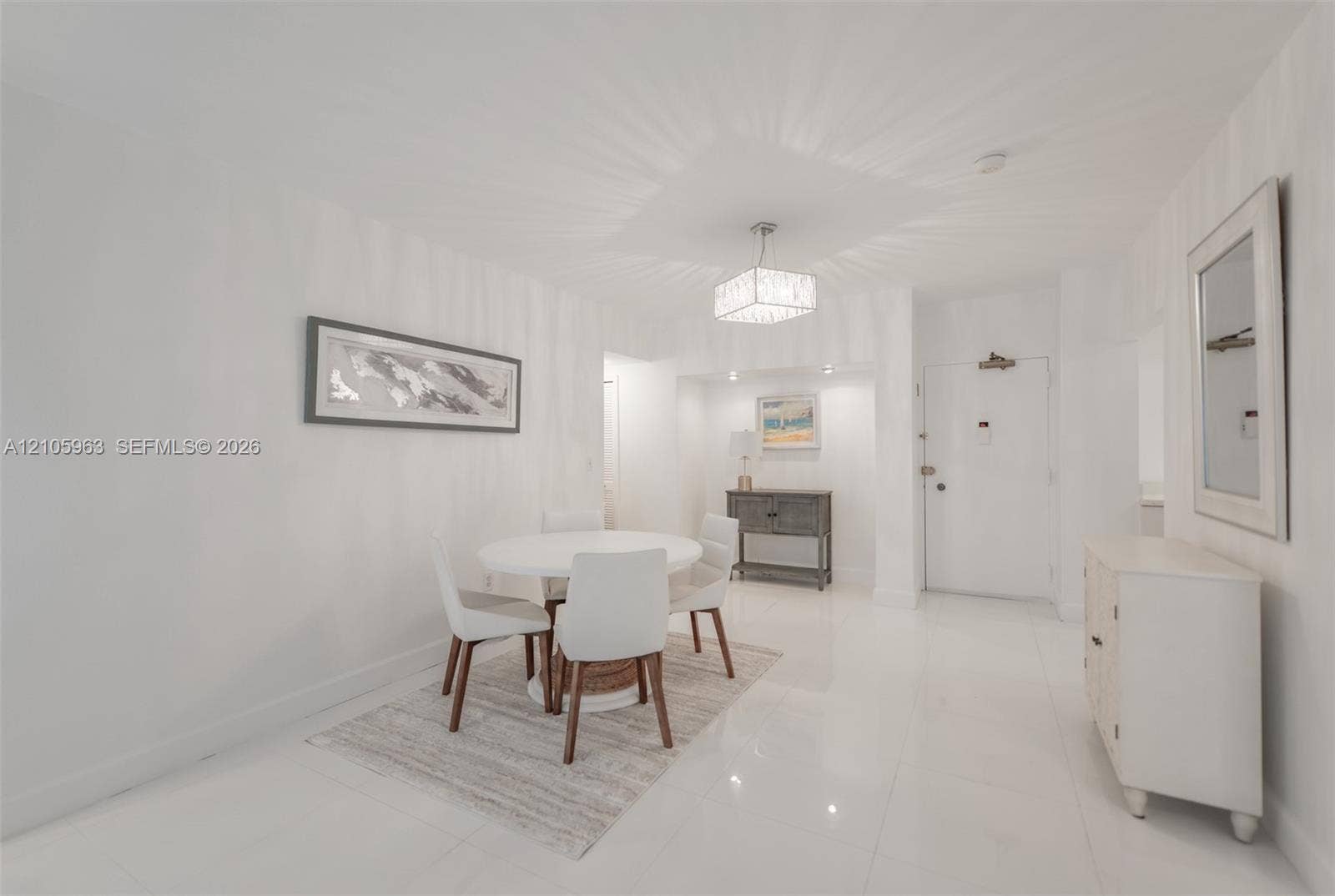 1980 S Ocean Drive, #PHA, Hallandale Beach, Hallandale Beach, FL 33009 Polished white flooring, recessed accent lighting in a dedicated alcove, and a decorative drum-style chandelier