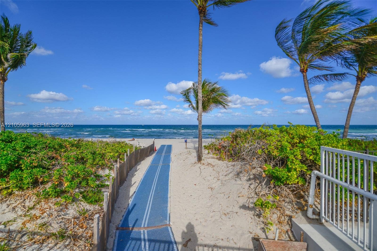 1980 S Ocean Drive, #PHA, Hallandale Beach, Hallandale Beach, FL 33009 Private sandy path featuring direct beach access, coastal vegetation, and mature palm trees